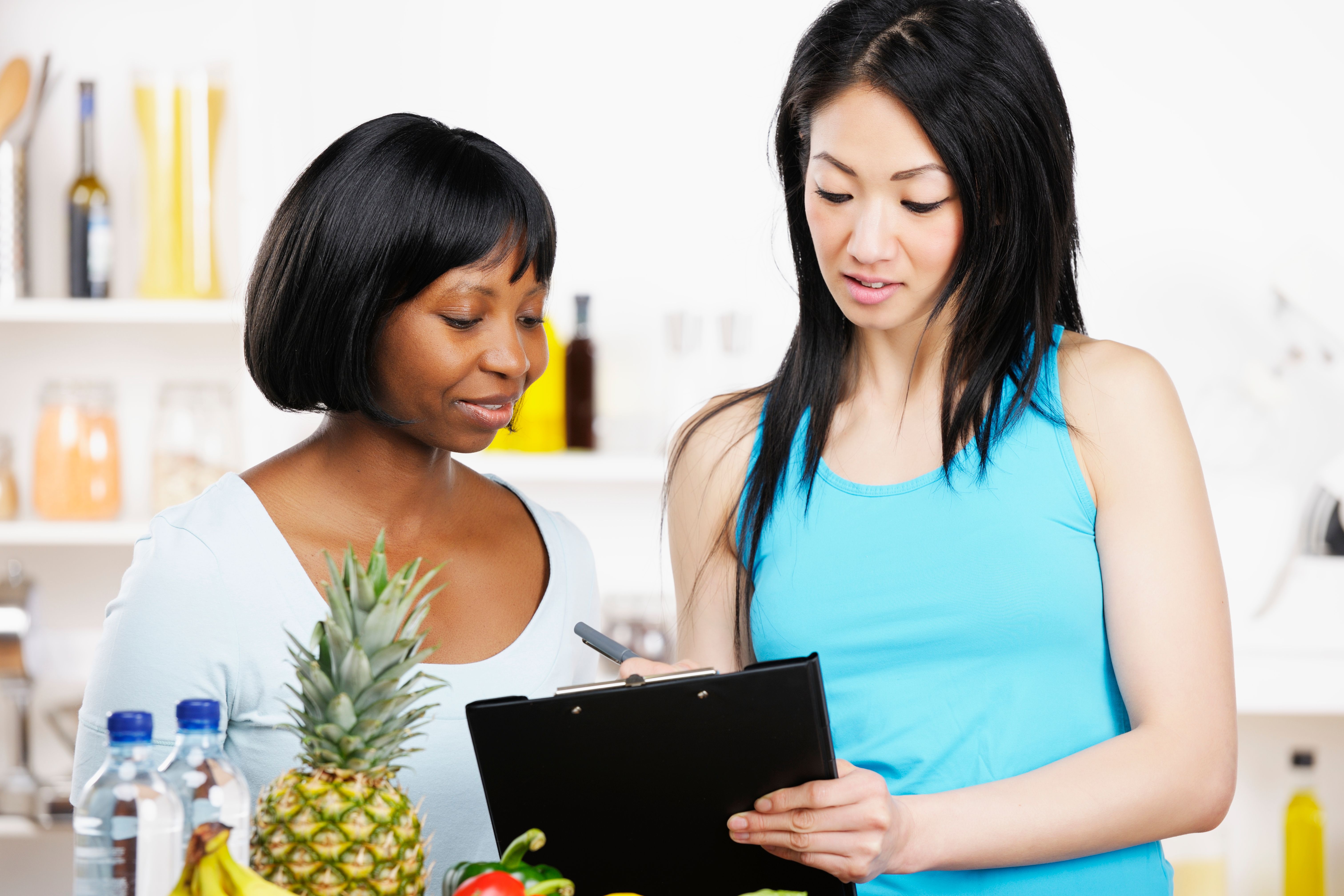 Dietician Doing A Consultation With Client In The Kitchen