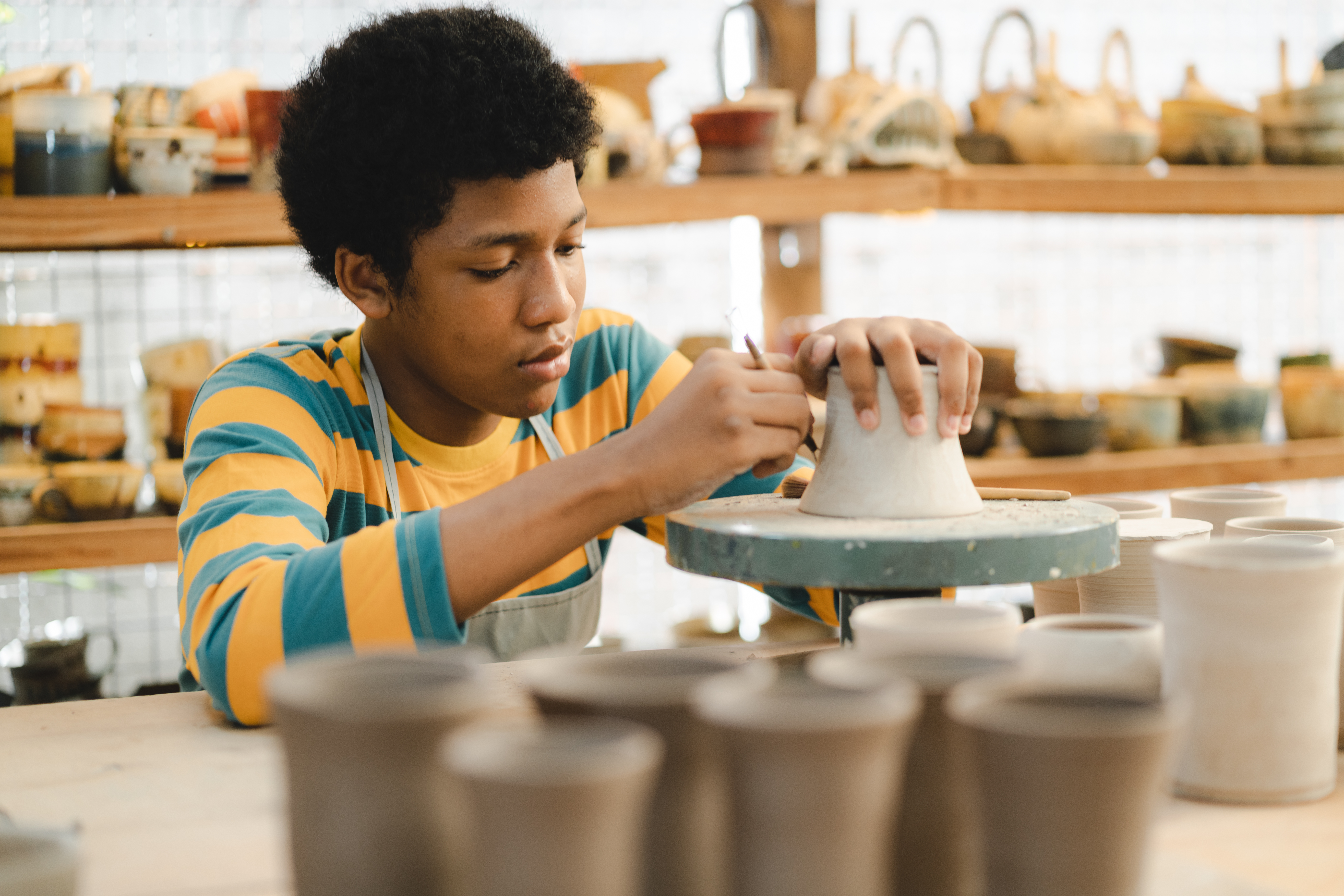 handcraft artist person using art skill of creativity to making ceramic clay craft pottery workshop by hand finger, wet and dirty work with mud for shape bowl traditional in hobby or manufacturing