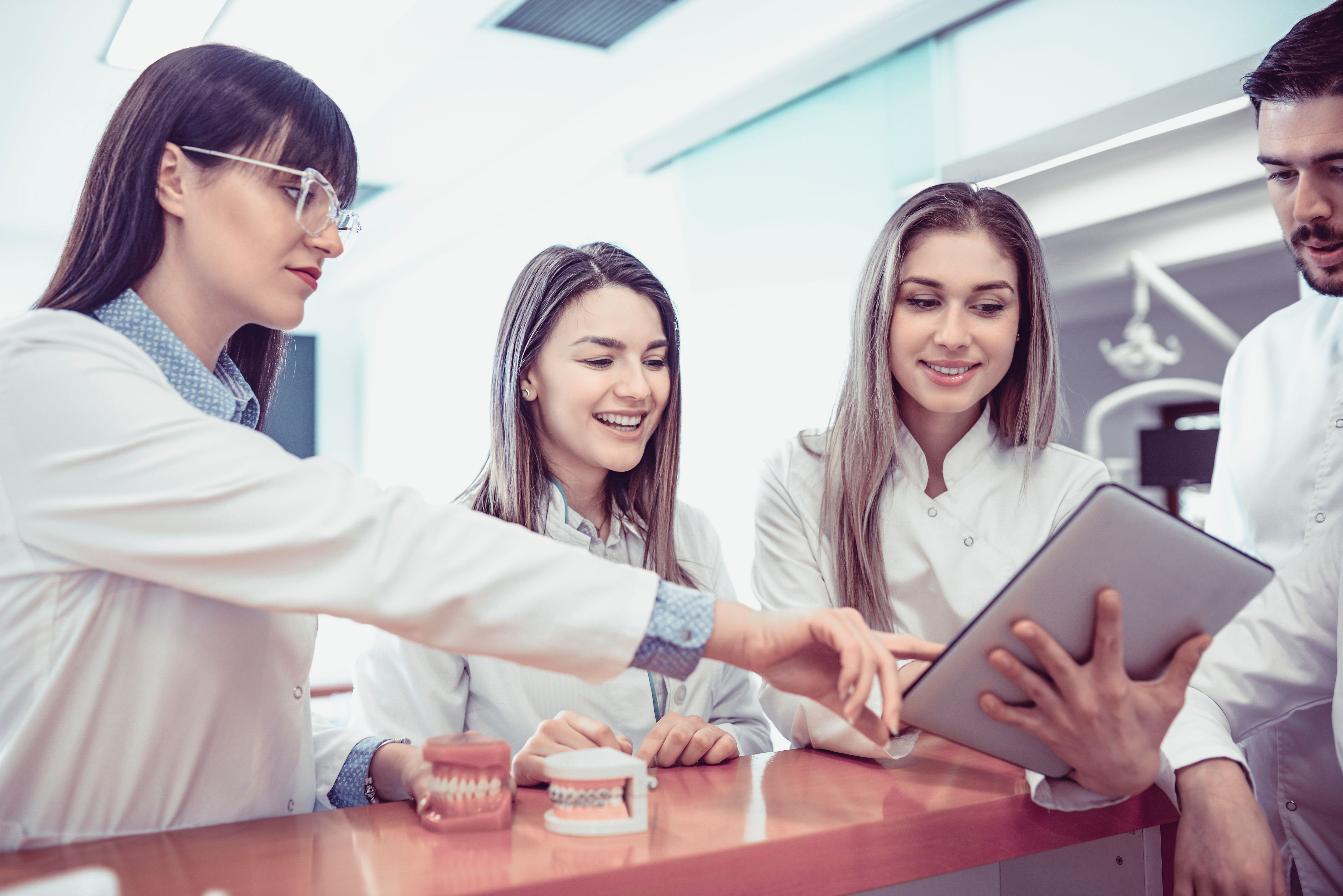Young Medical Team Have Small Meeting at Clinics Reception