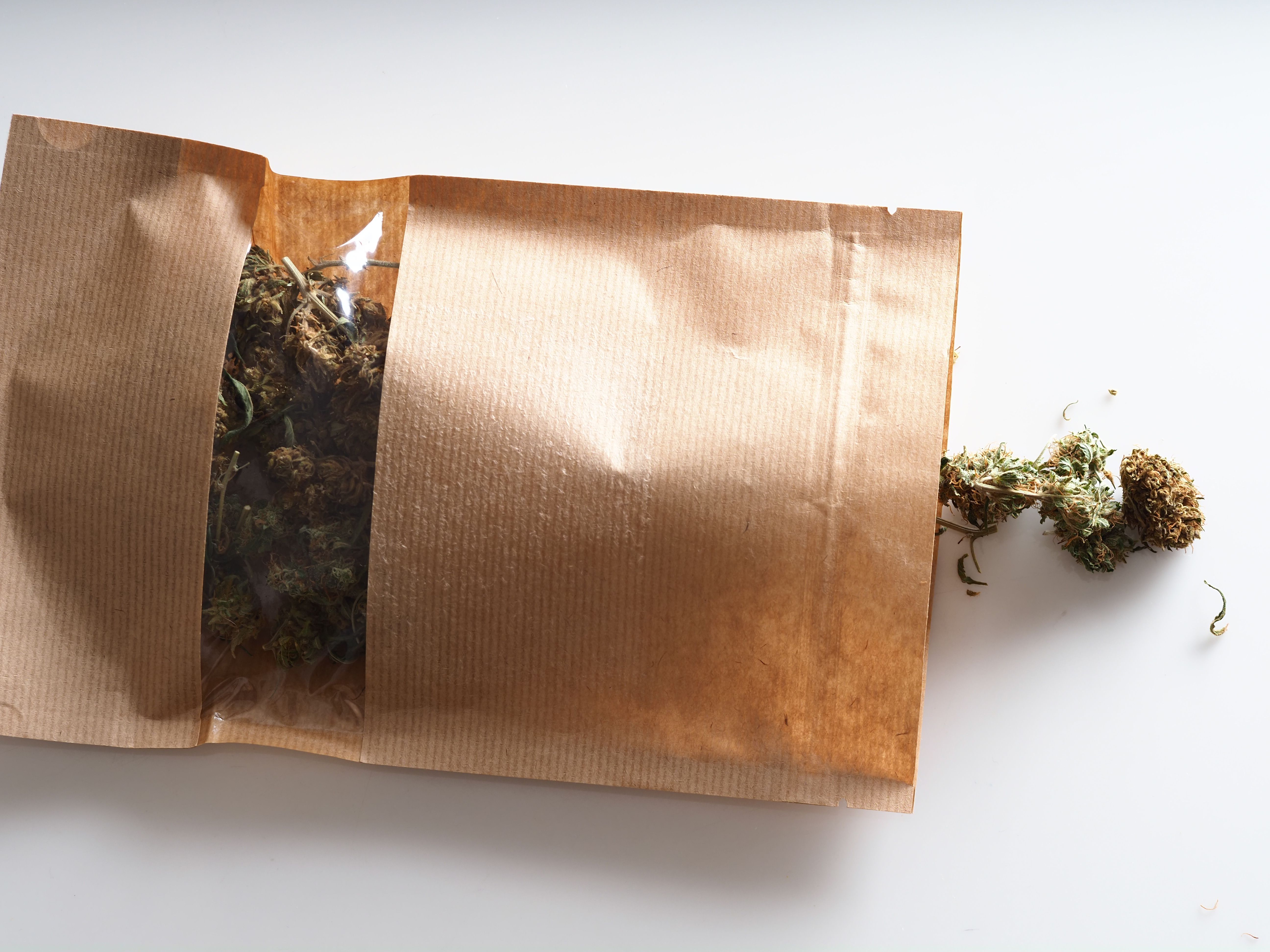 dry flowers medical marijuana in paper bag