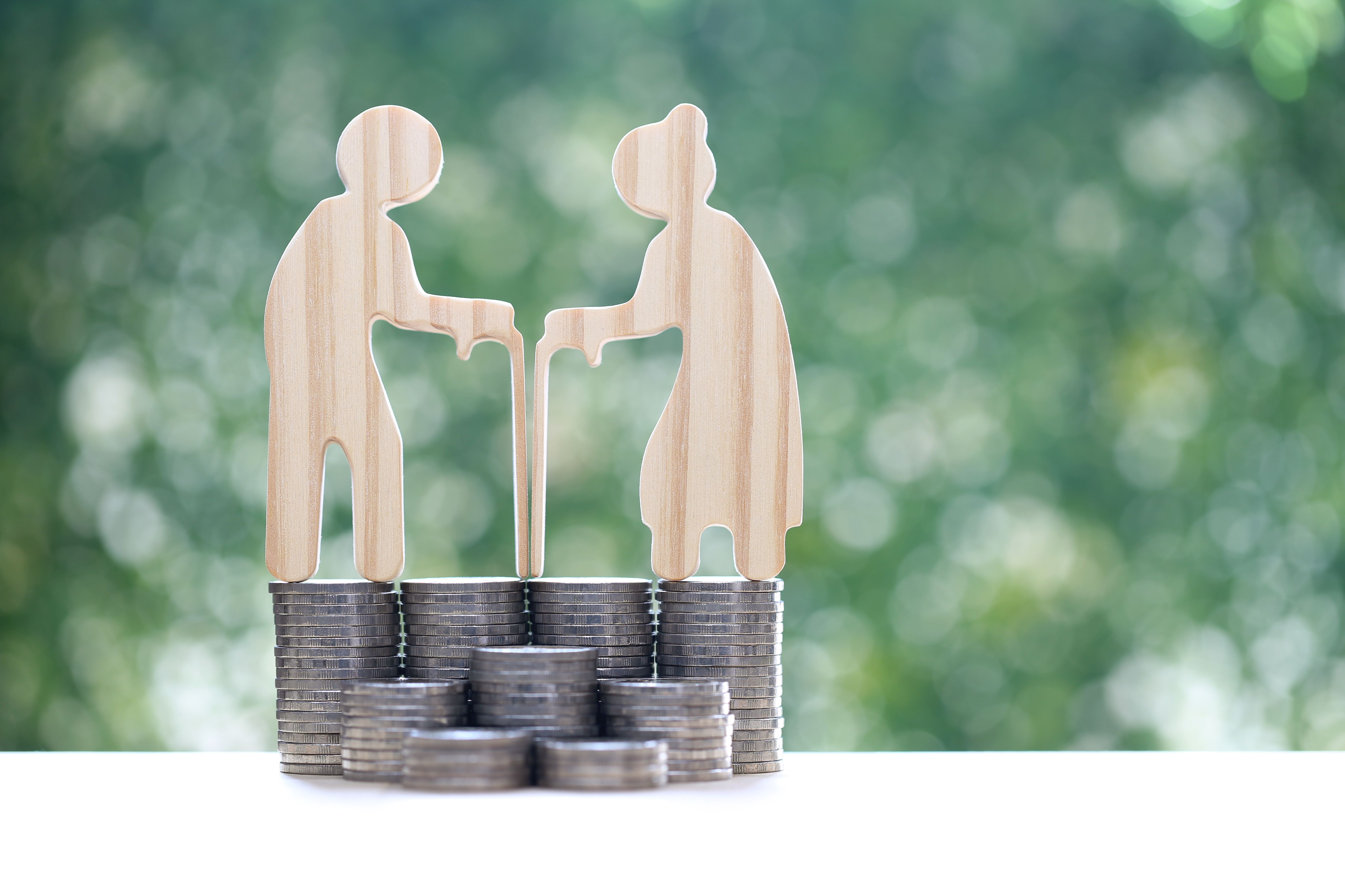 Mutual fund,Love couple senior and stack of coins money on natural green background, Save money for prepare in future and pension retirement concept