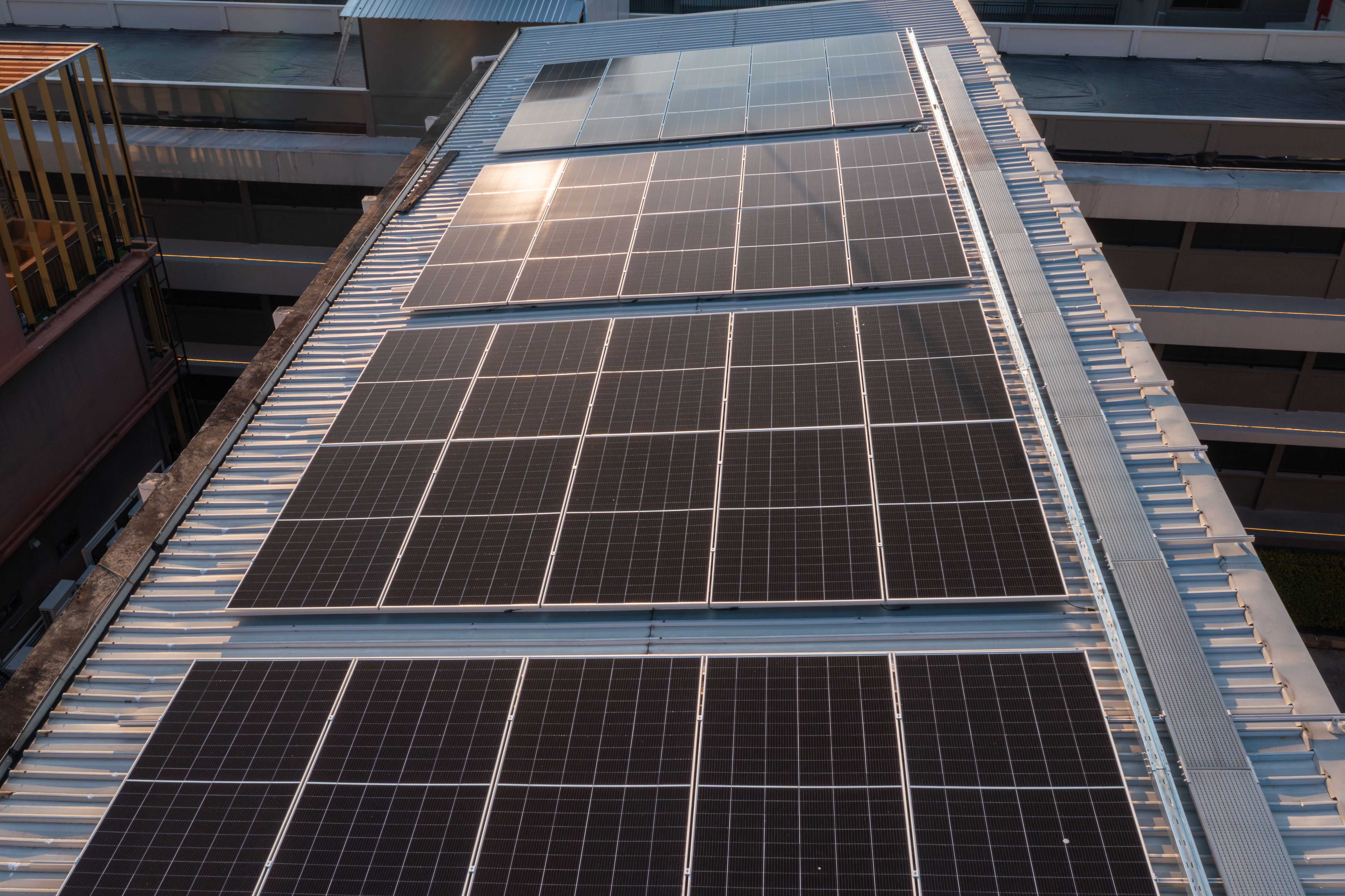 Aerial View of Engineers Installing Solar Panels