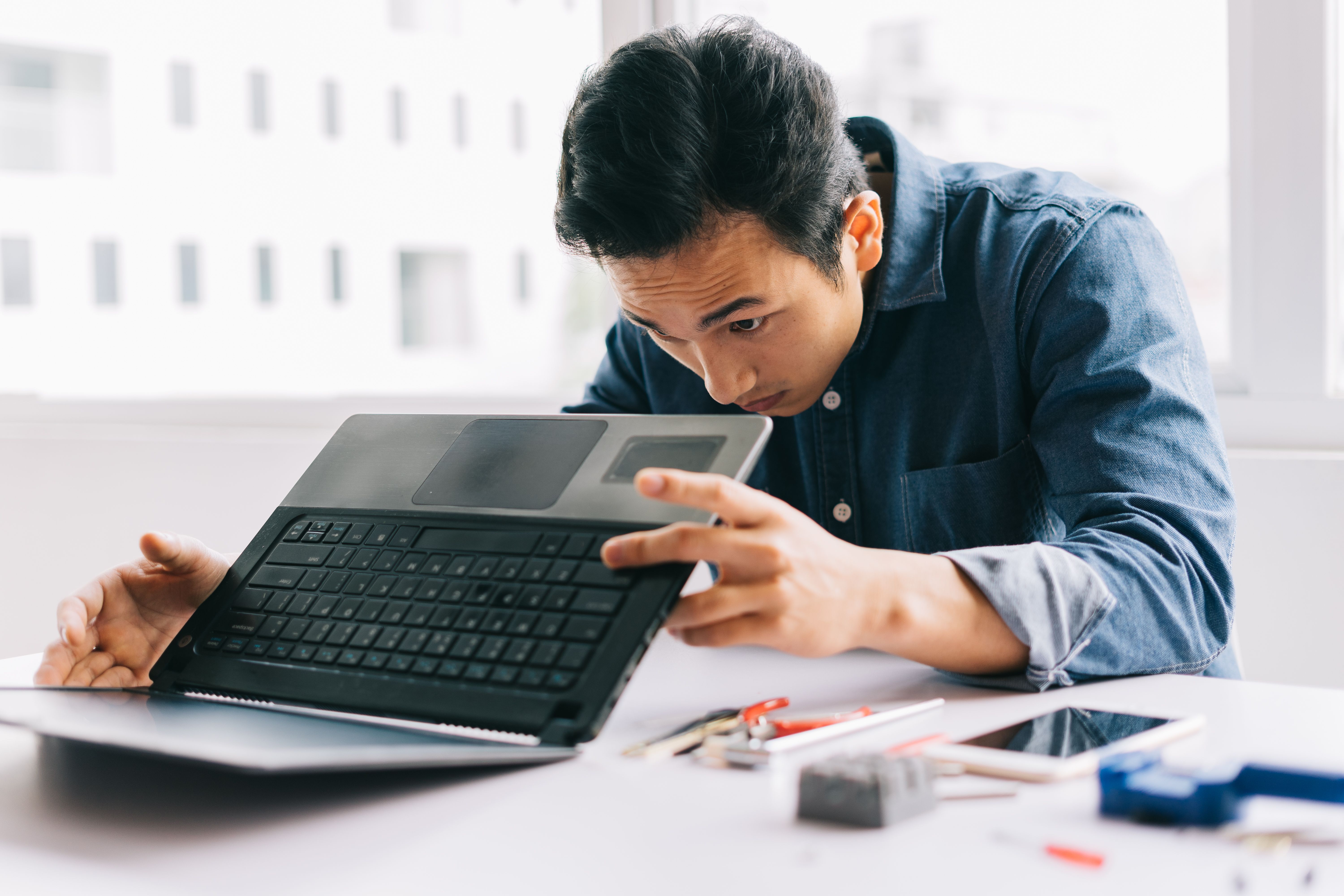 man repairing computer