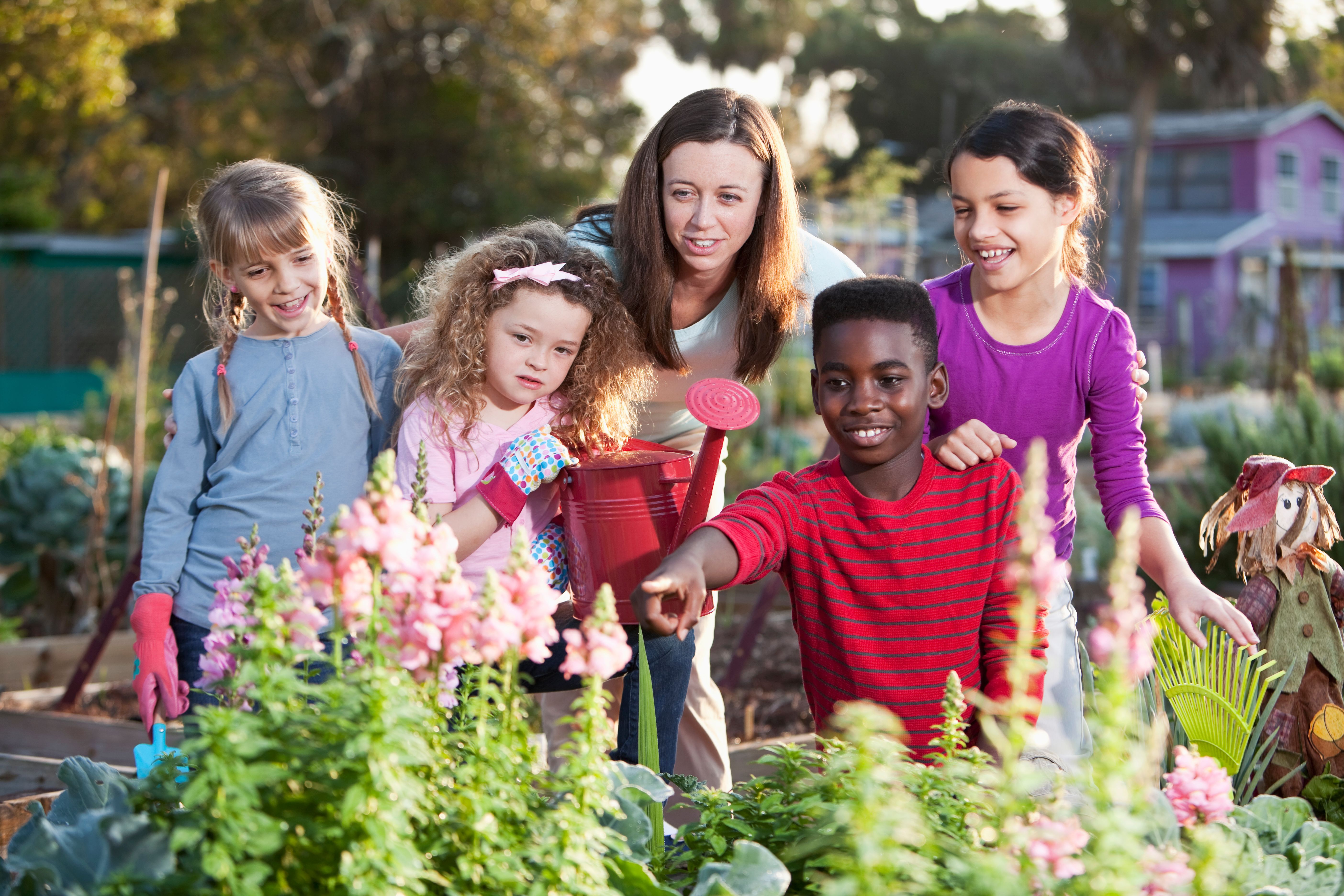 Woman and children at community garden