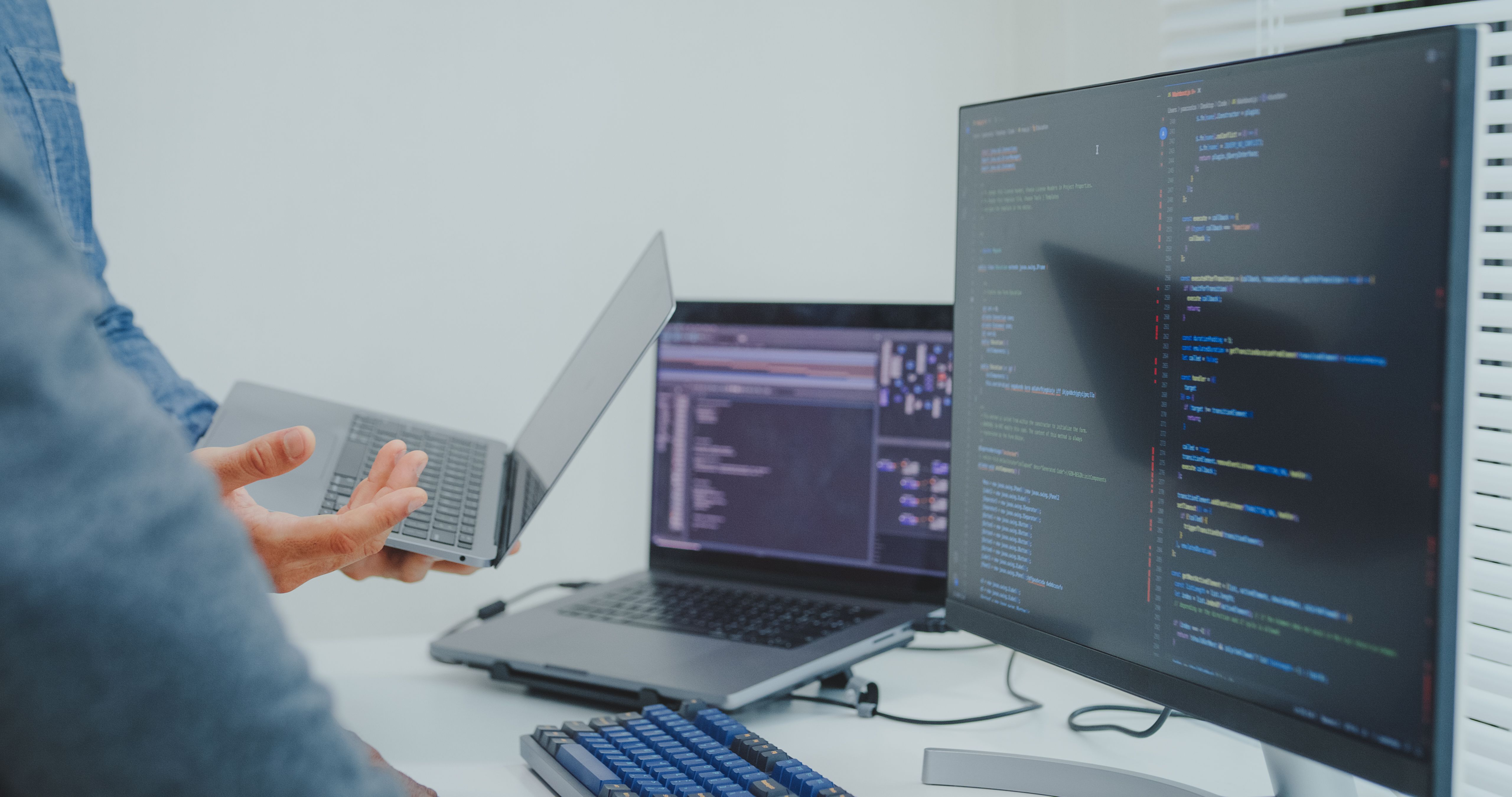 Closeup Black and Hispanic male engineers programmer work together collaborate discuss software strategies and code analysis for web design in tech office. Software developer, artificial intelligence.