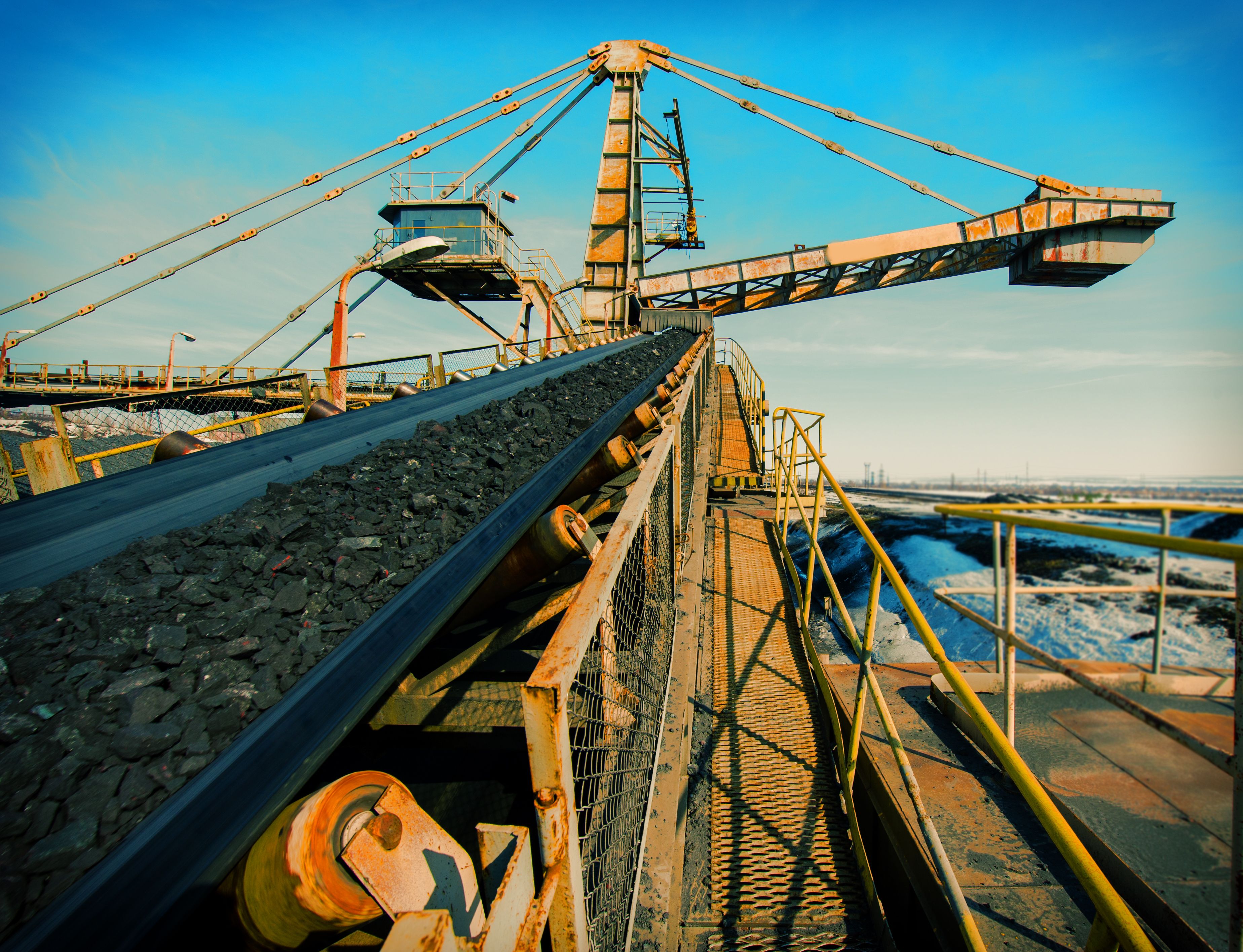 Close-up of a conveyor by the water