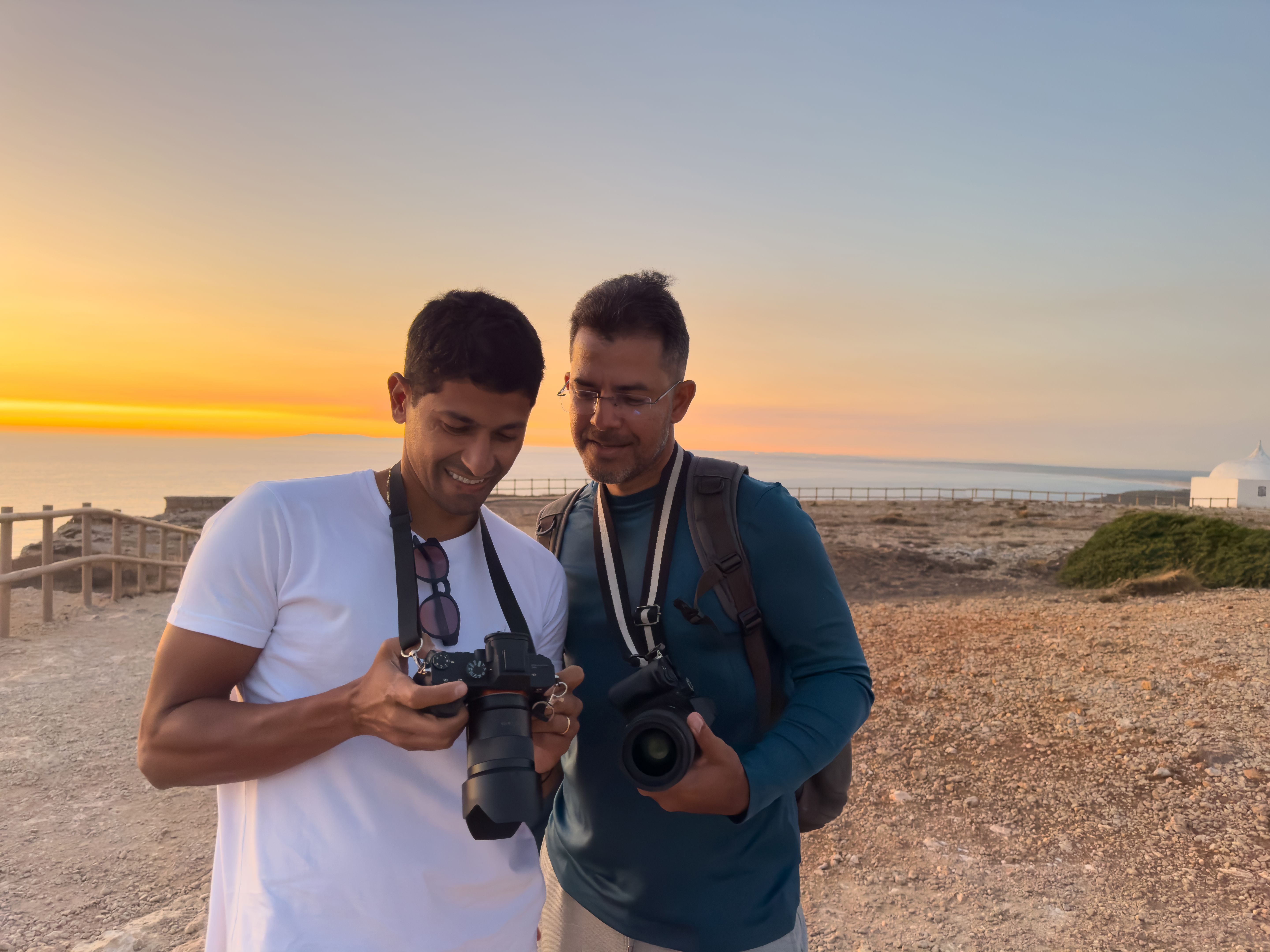 Photographer shows photo to friend at tourist spot
