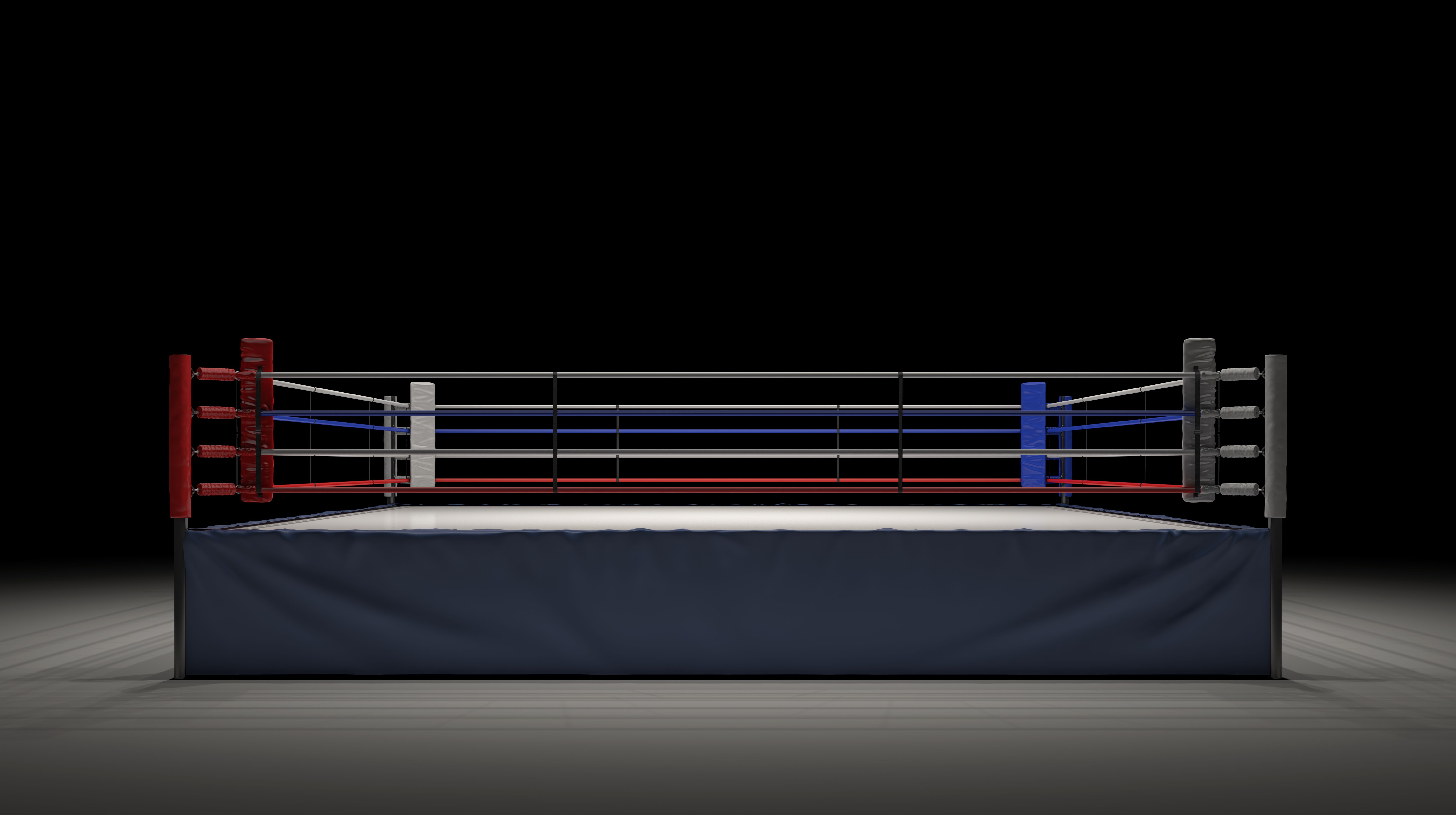 3d rendering of an empty boxing ring in front view spotlighted in the dark