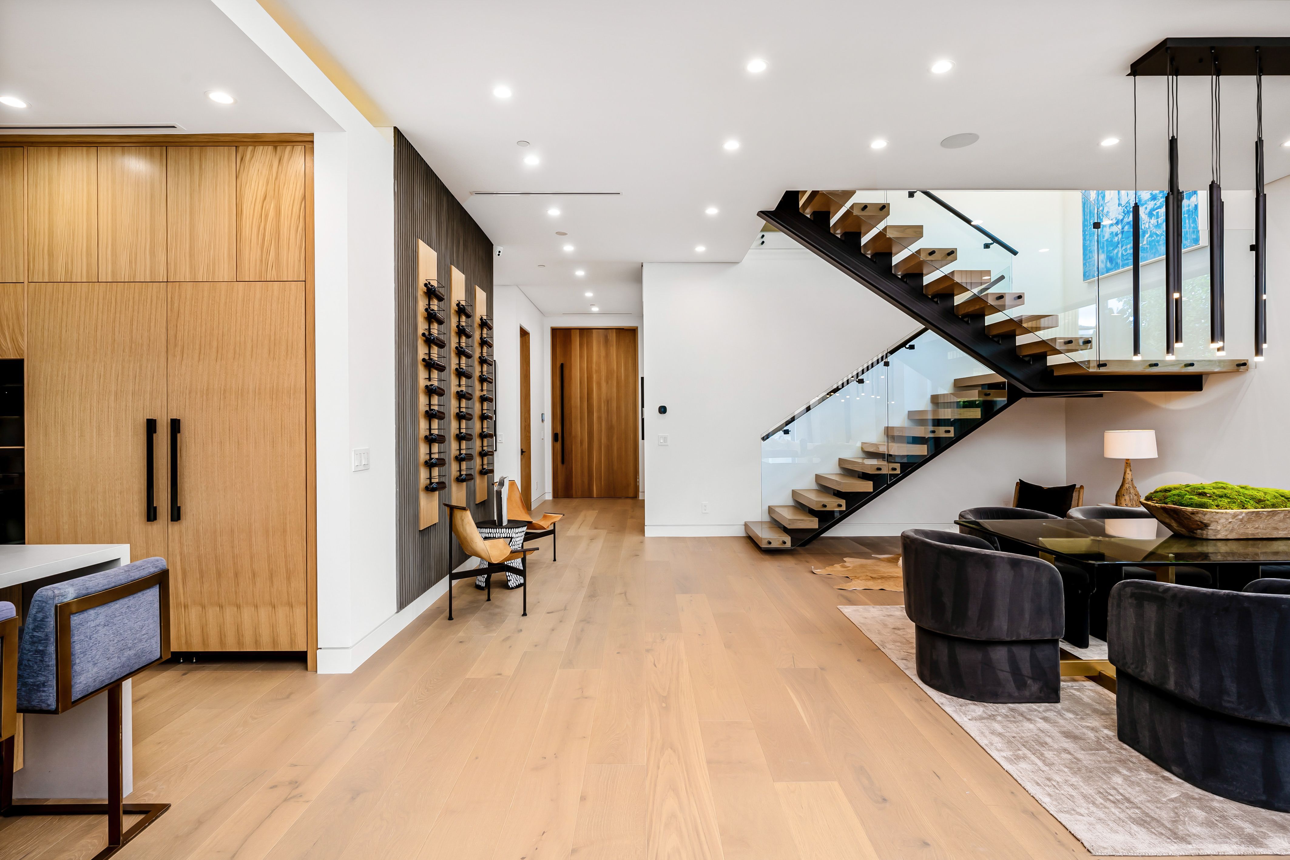 Modern luxury home interior with open space and stylish staircase.
