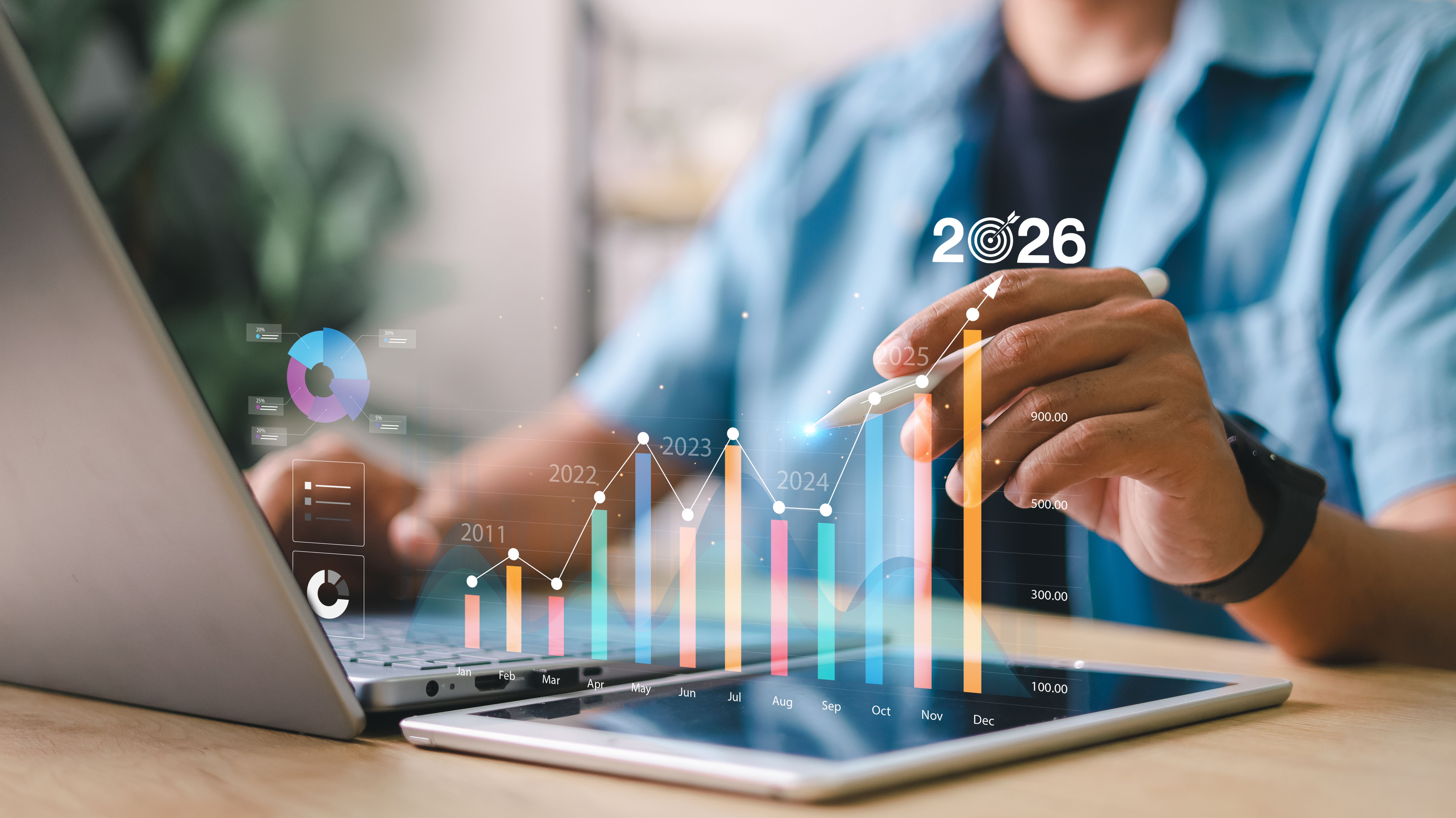 Businessman analyzing digital data graph with yearly growth trends and bar charts. Concept of financial forecast, KPI dashboard, and business performance analytics.