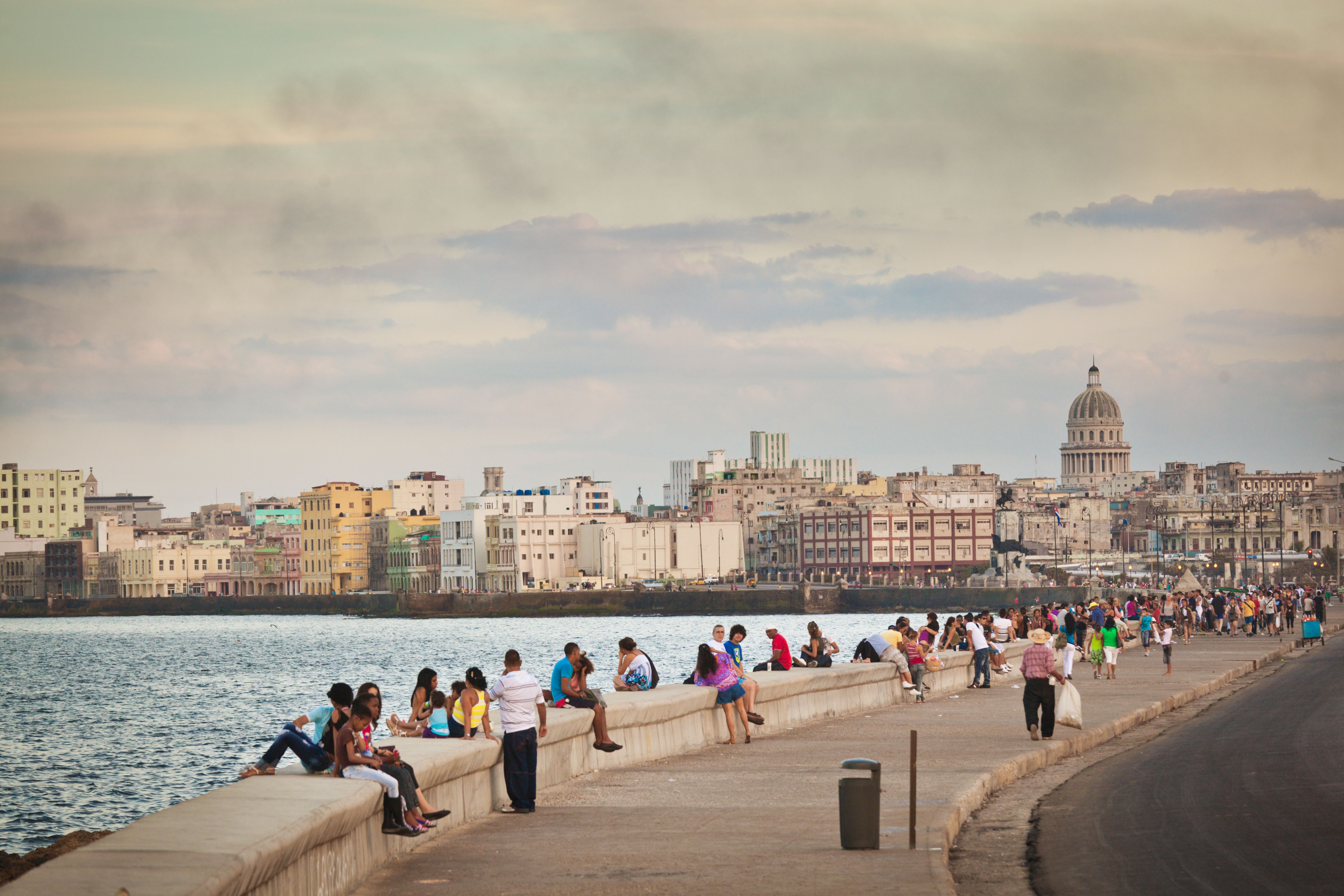 Malecón, Old Havana, Cuba, with People Relaxing on Seawall Malecón, Old Havana, Cuba, with People Relaxing on Seawall