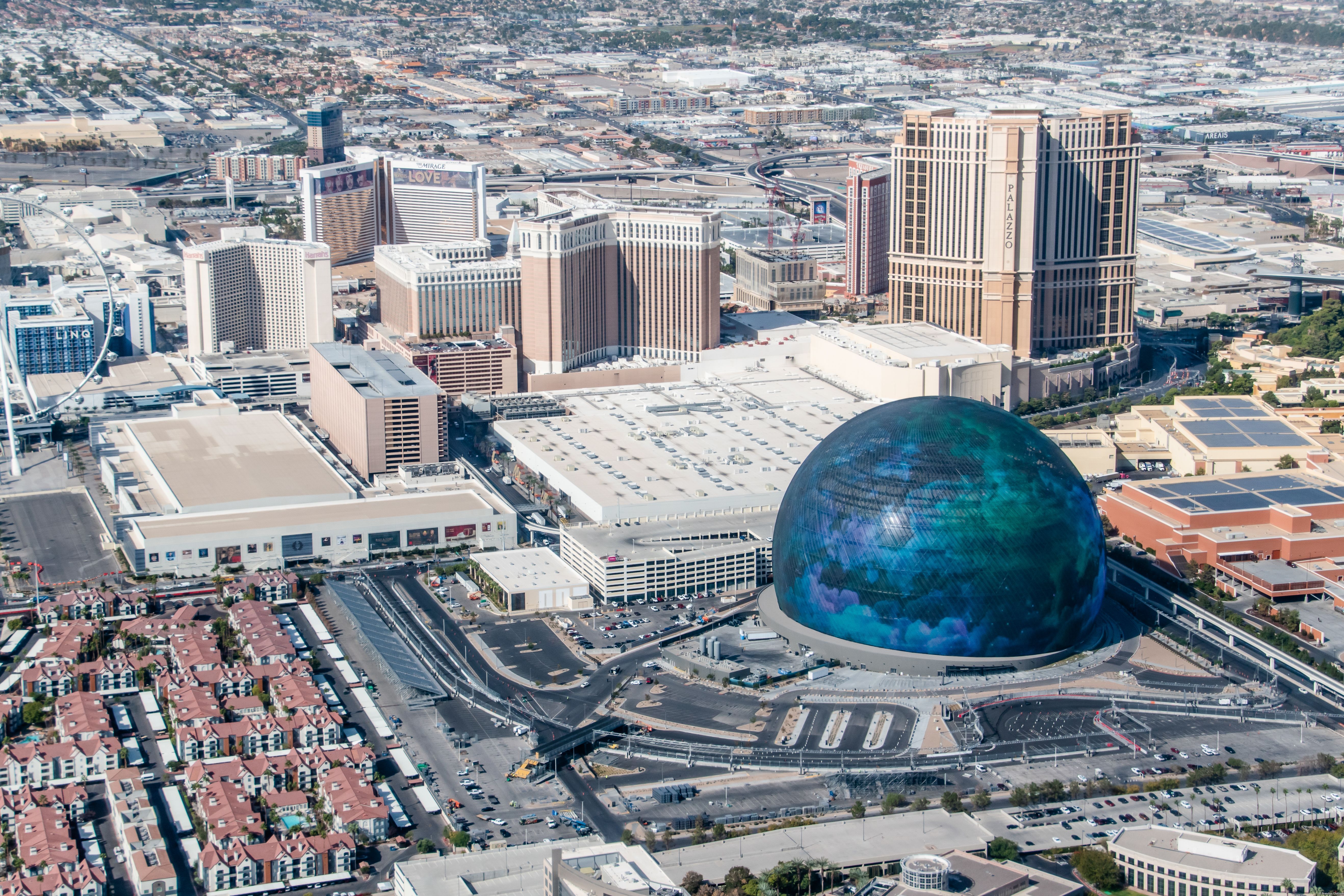 Aerial View of The Las Vegas Sphere With Blue Visual and City Skyline in Las Vegas, NV