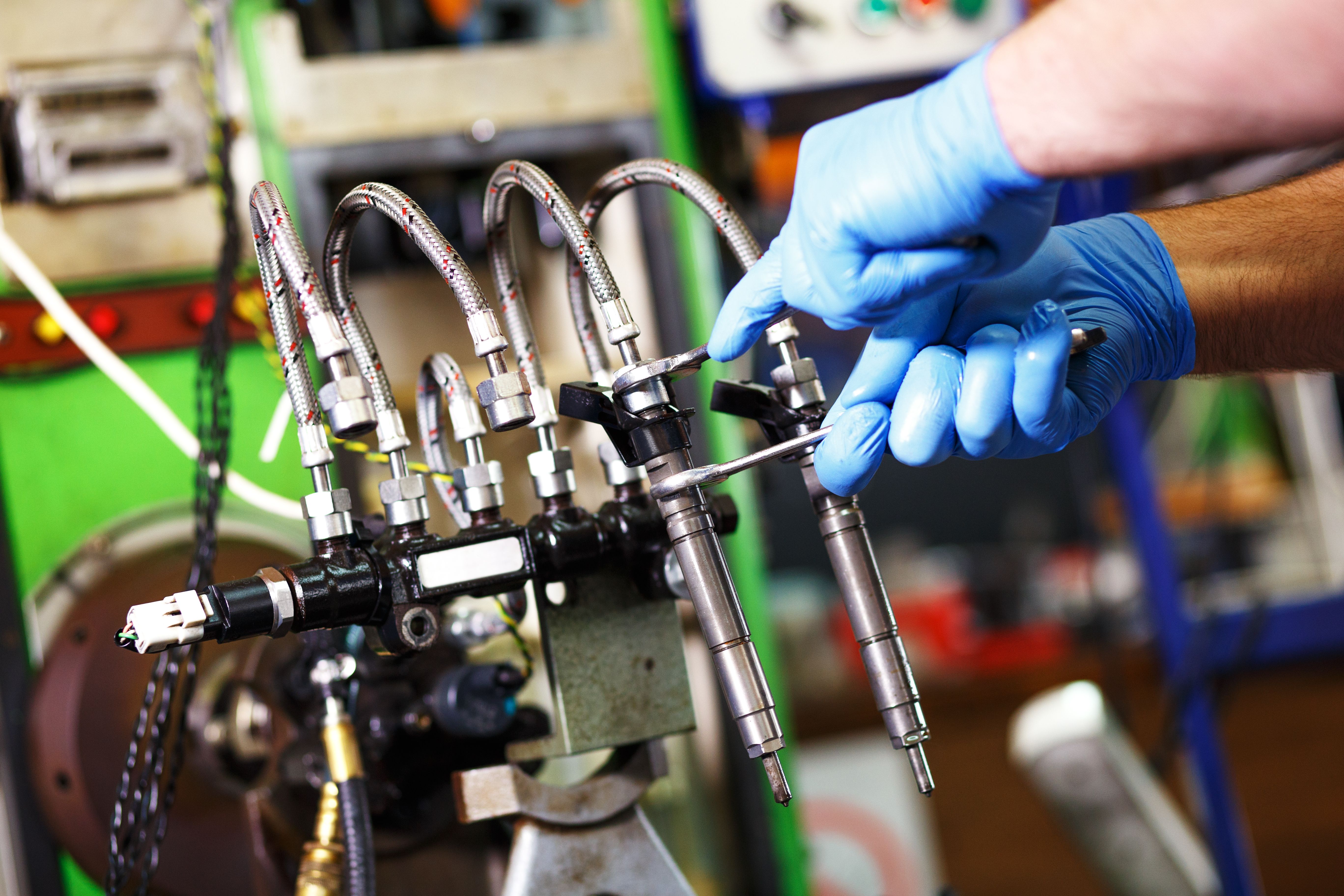 Mechanic testing diesel injector