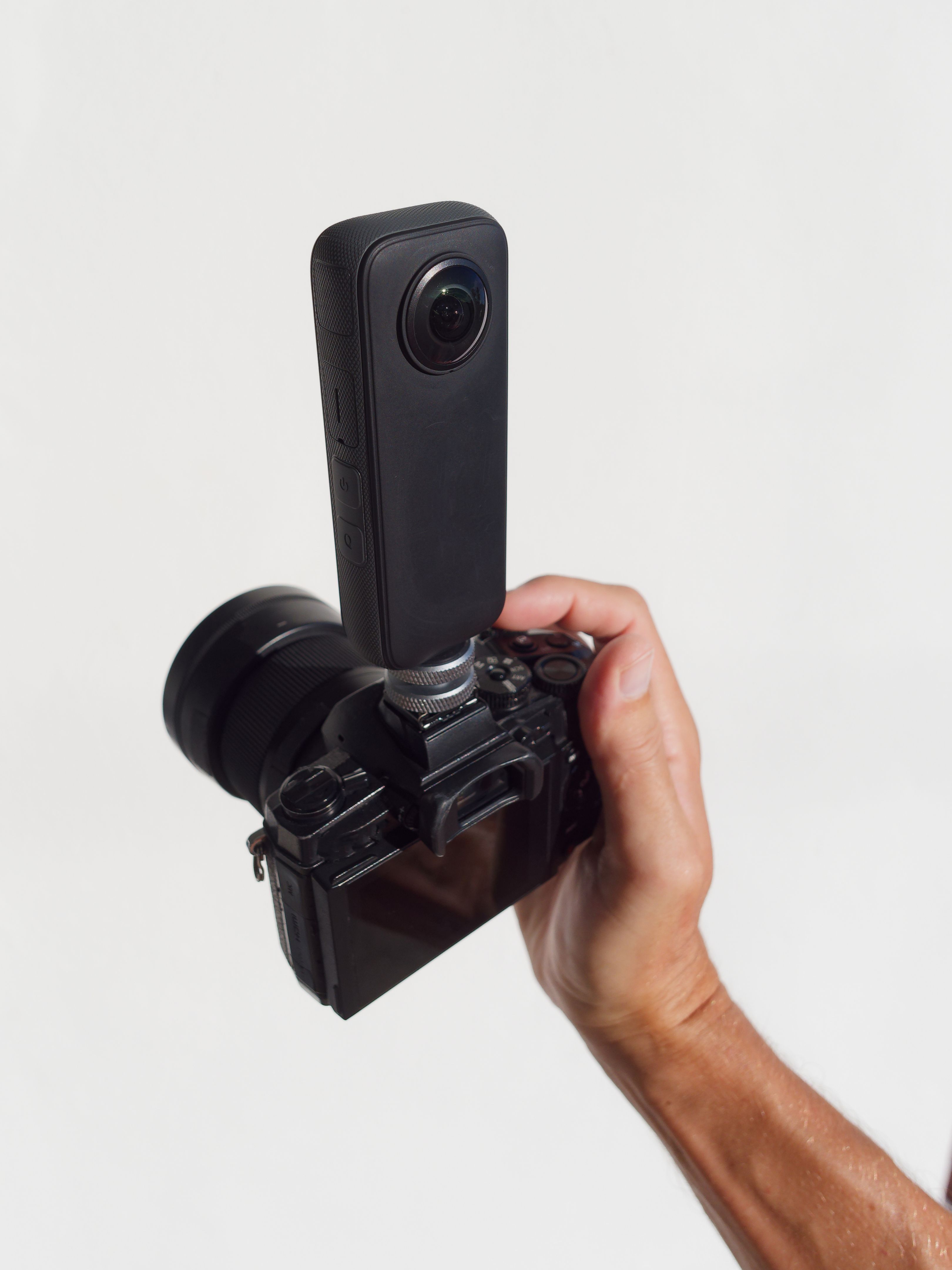 360 camera mounted on digital camera for POV photography.
