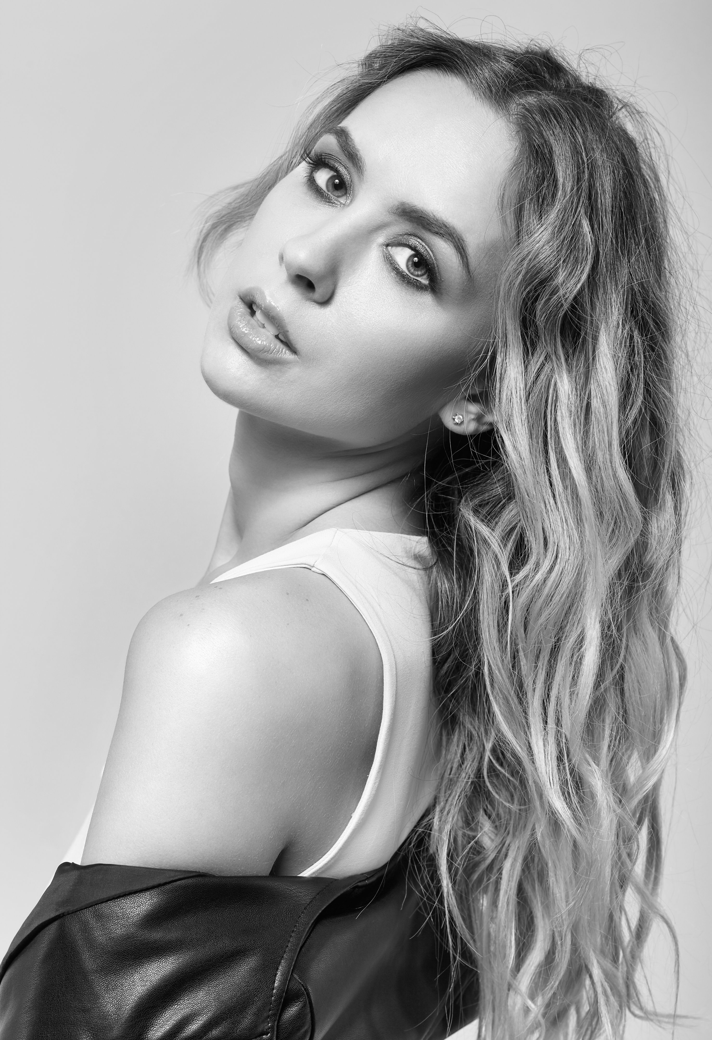 Portrait of young female with black leather jacket