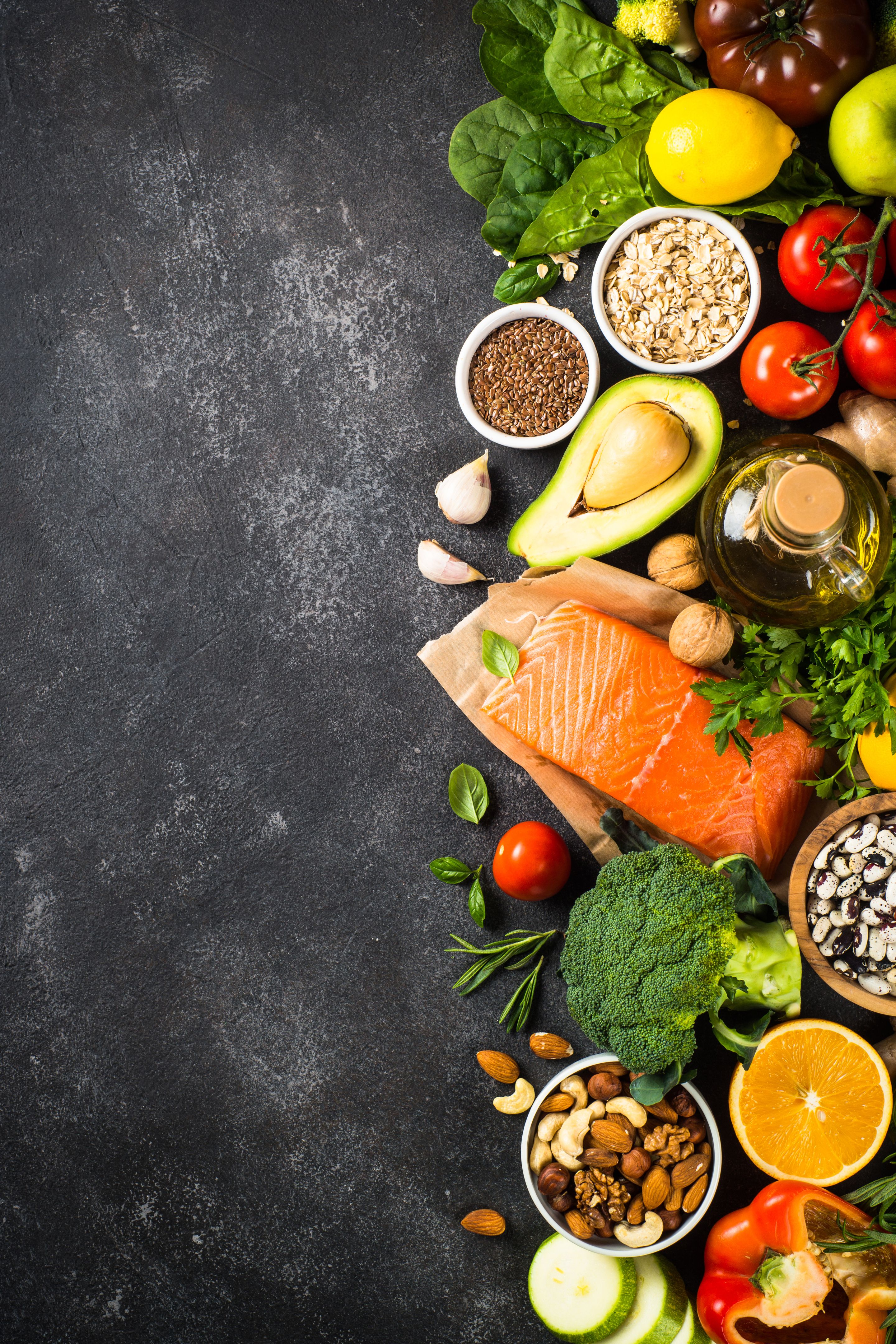 Healthy vegan food at black background top view.