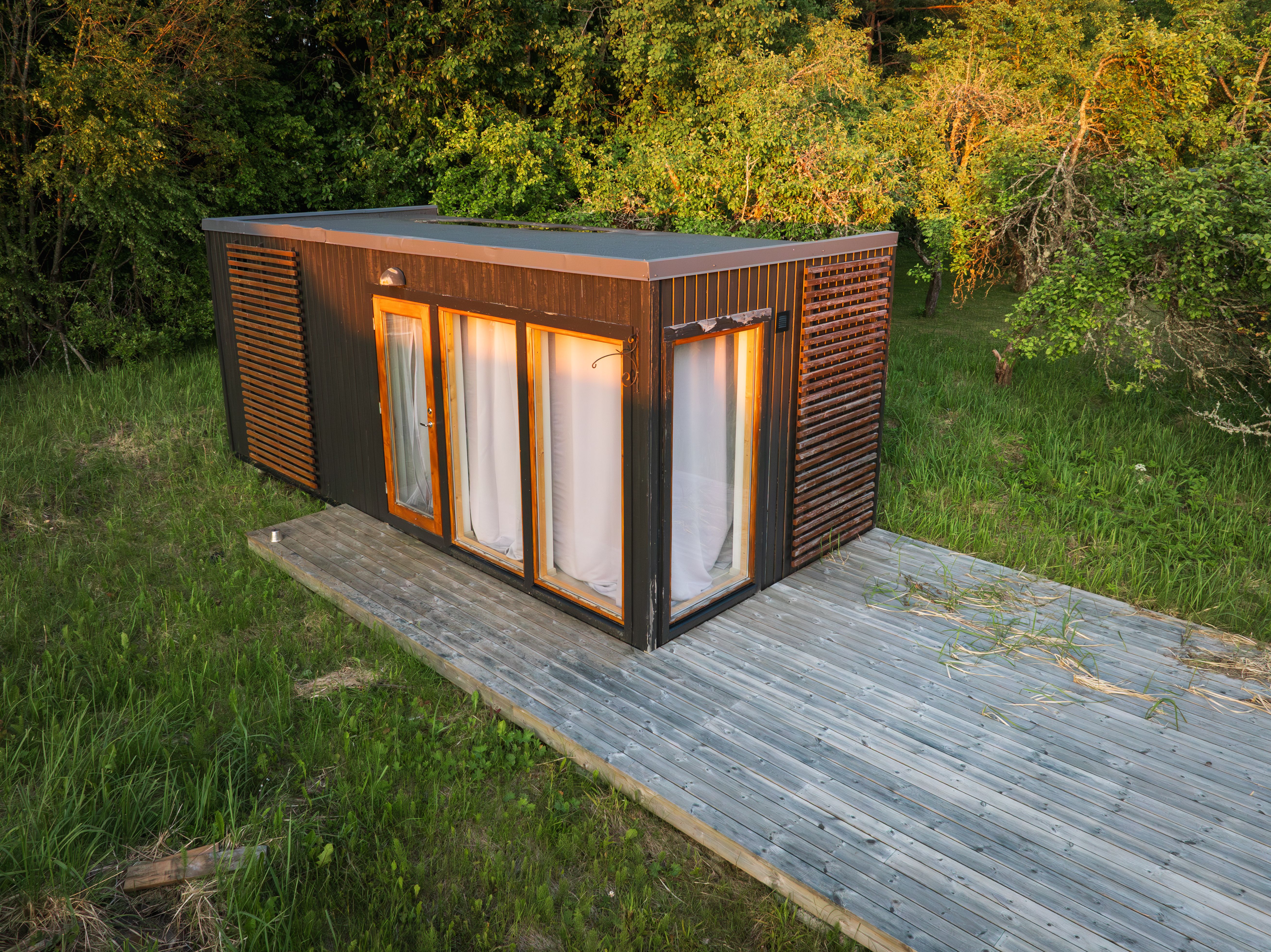An abandoned modern modular house in a forest in Estonia.