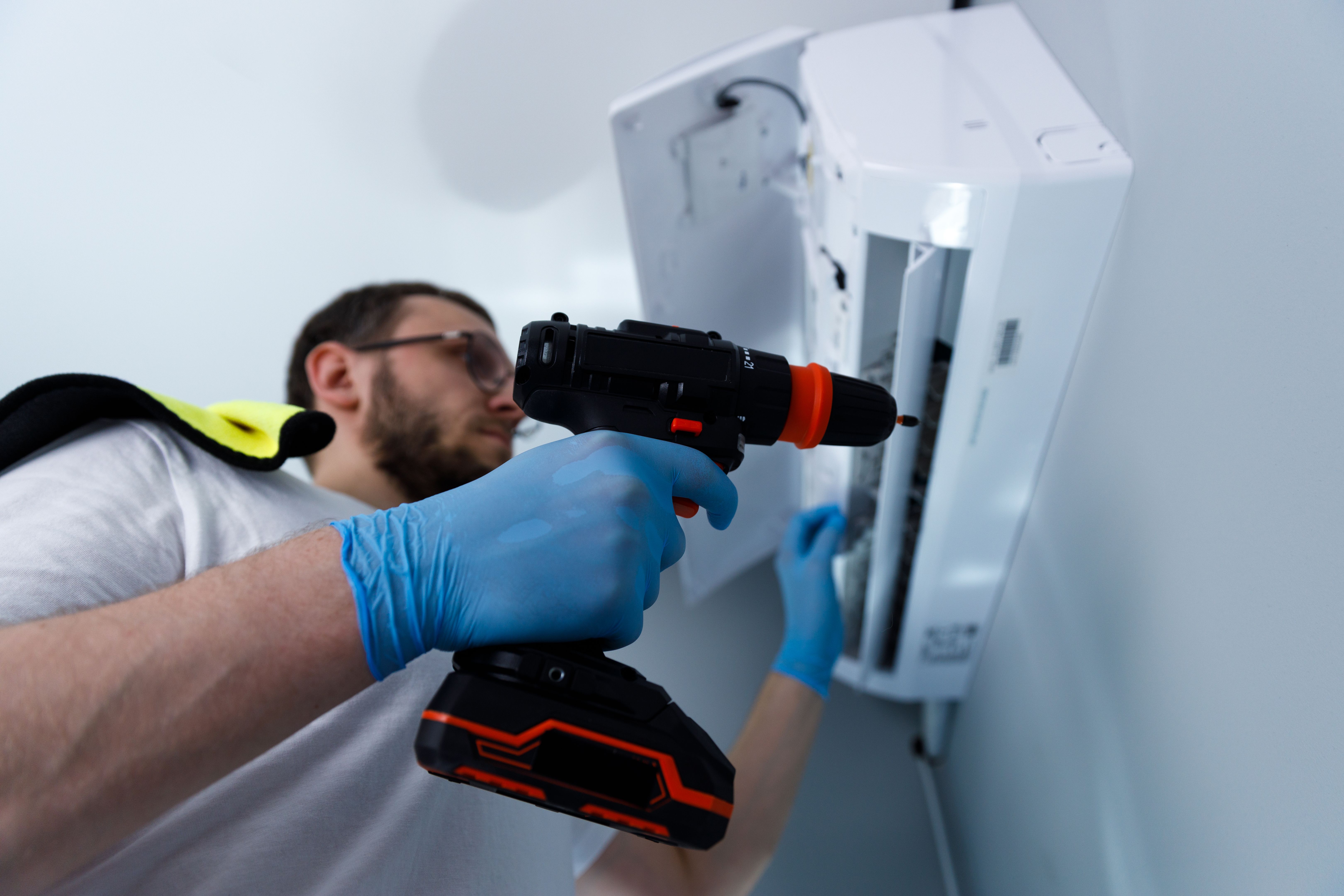 technician repairing drill