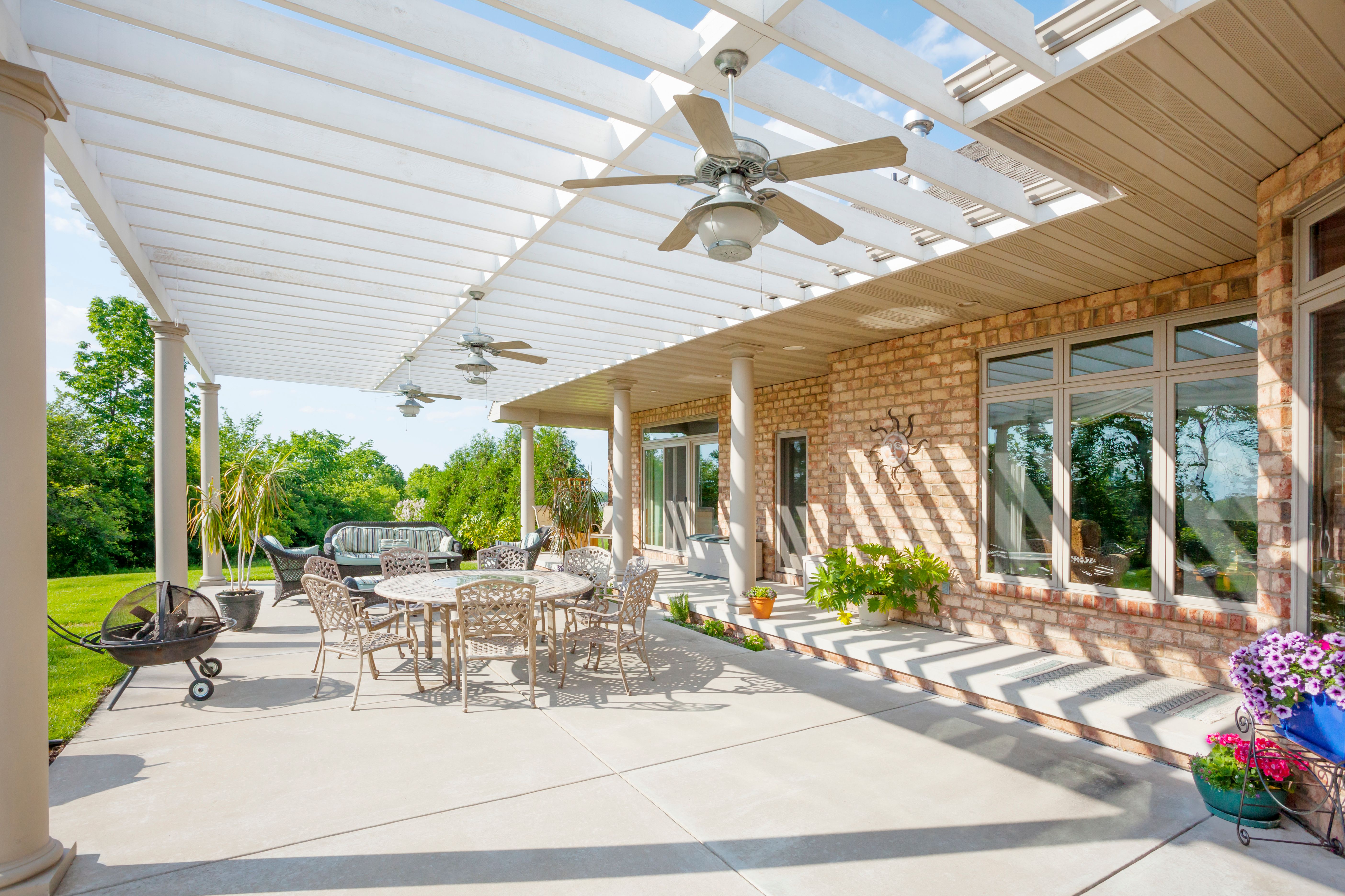 Covered concrete patio in Tampa with light-colored finish to reduce heat retention, shown as an example by Tampa concrete contractors. Covered concrete patio in Tampa with light-colored finish to reduce heat retention, shown as an example by Tampa concrete contractors.