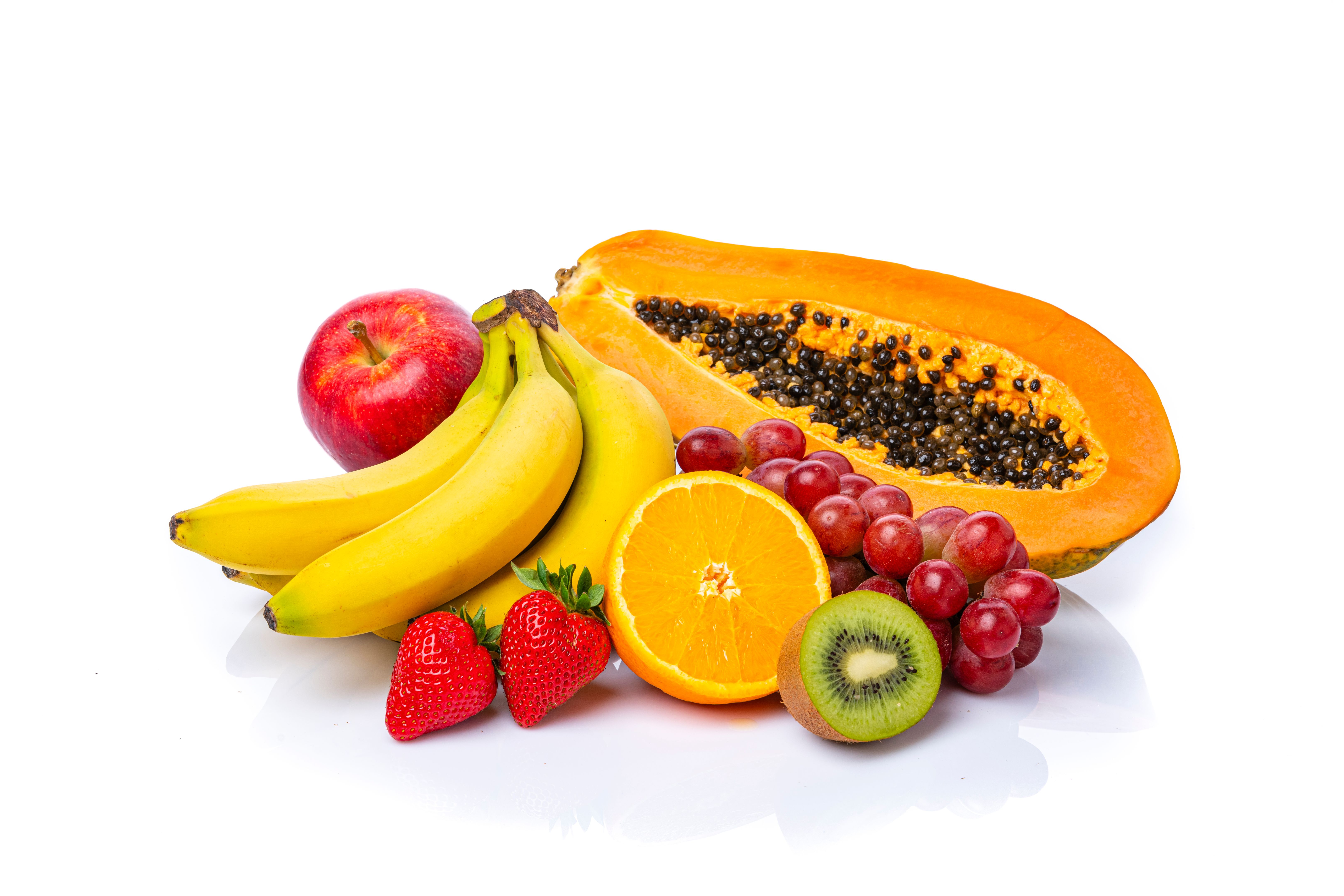 Juicy fruits shot on white background. Copy space