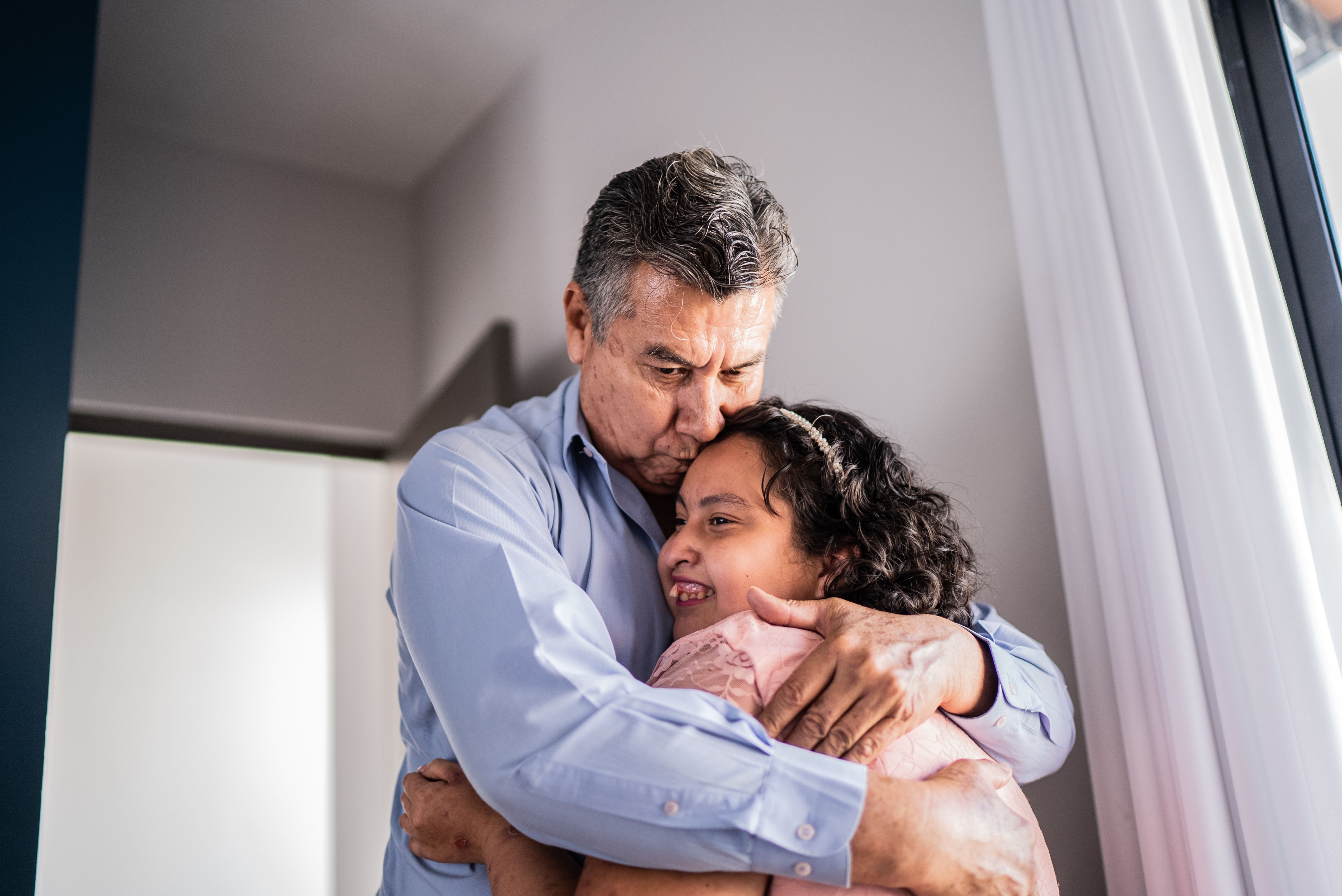 Psychomotor Intellectual disability daughter greeting father at home