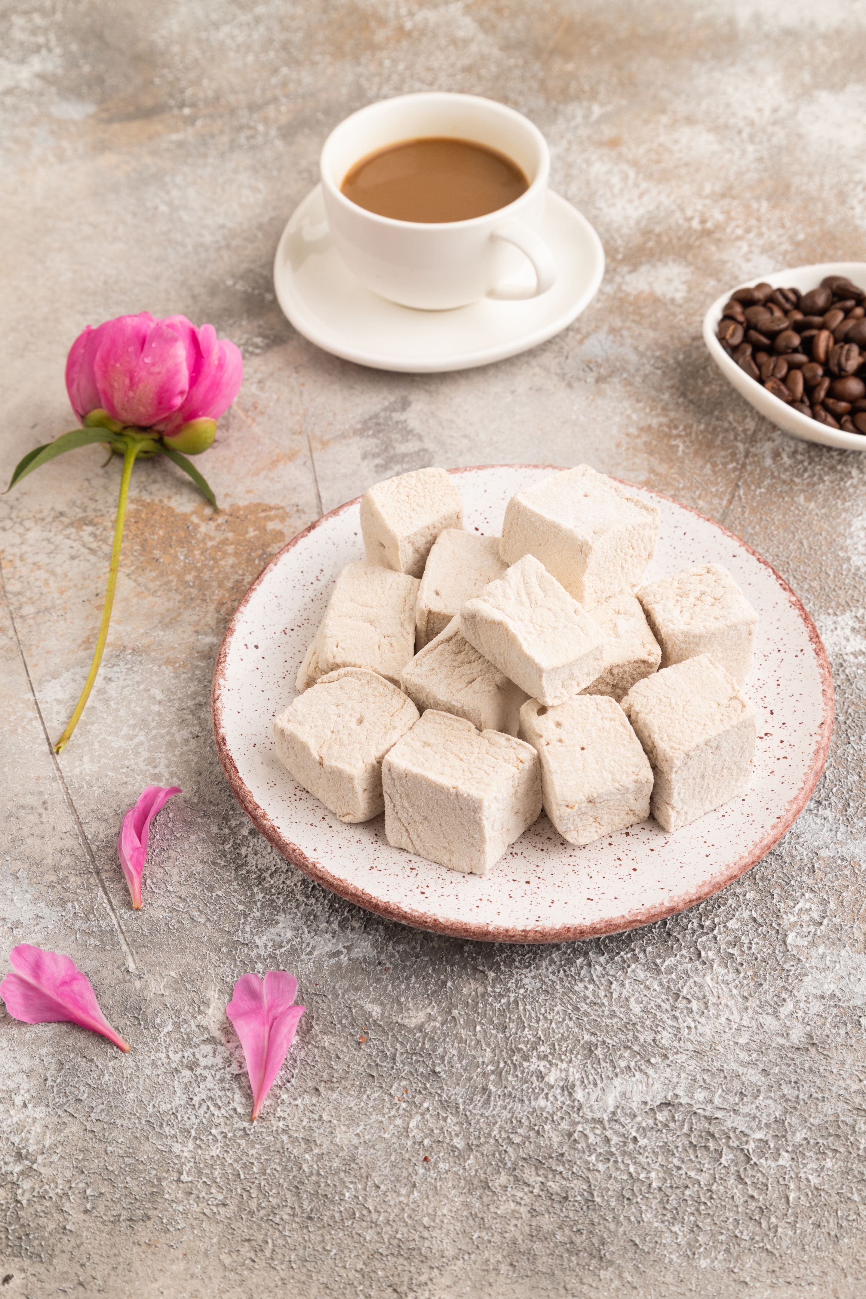 Coffee marshmallow with cup of coffee on brown concrete. side view Coffee marshmallow with cup of coffee on brown concrete. side view