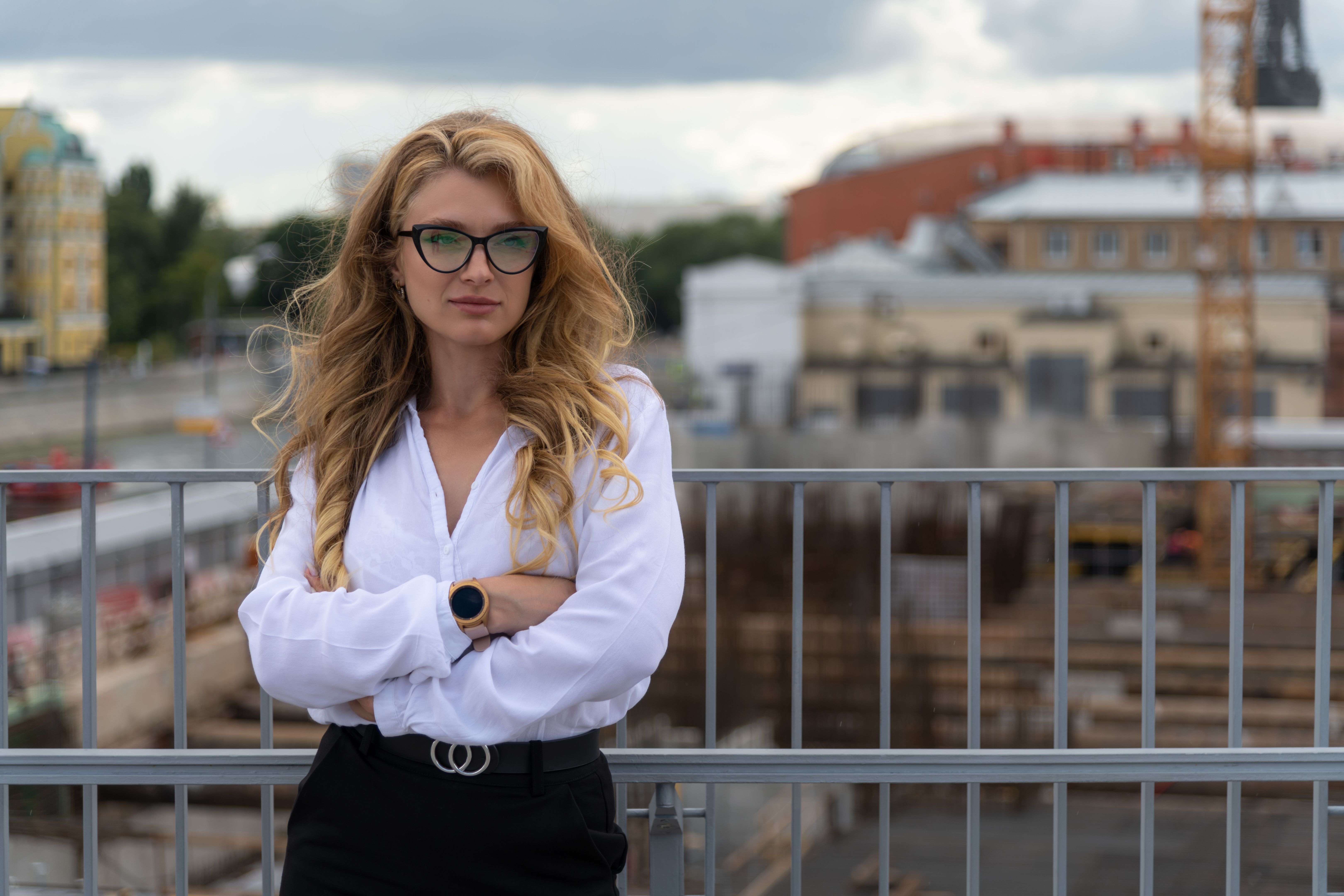 Confident business woman by construction site Confident business woman by construction site