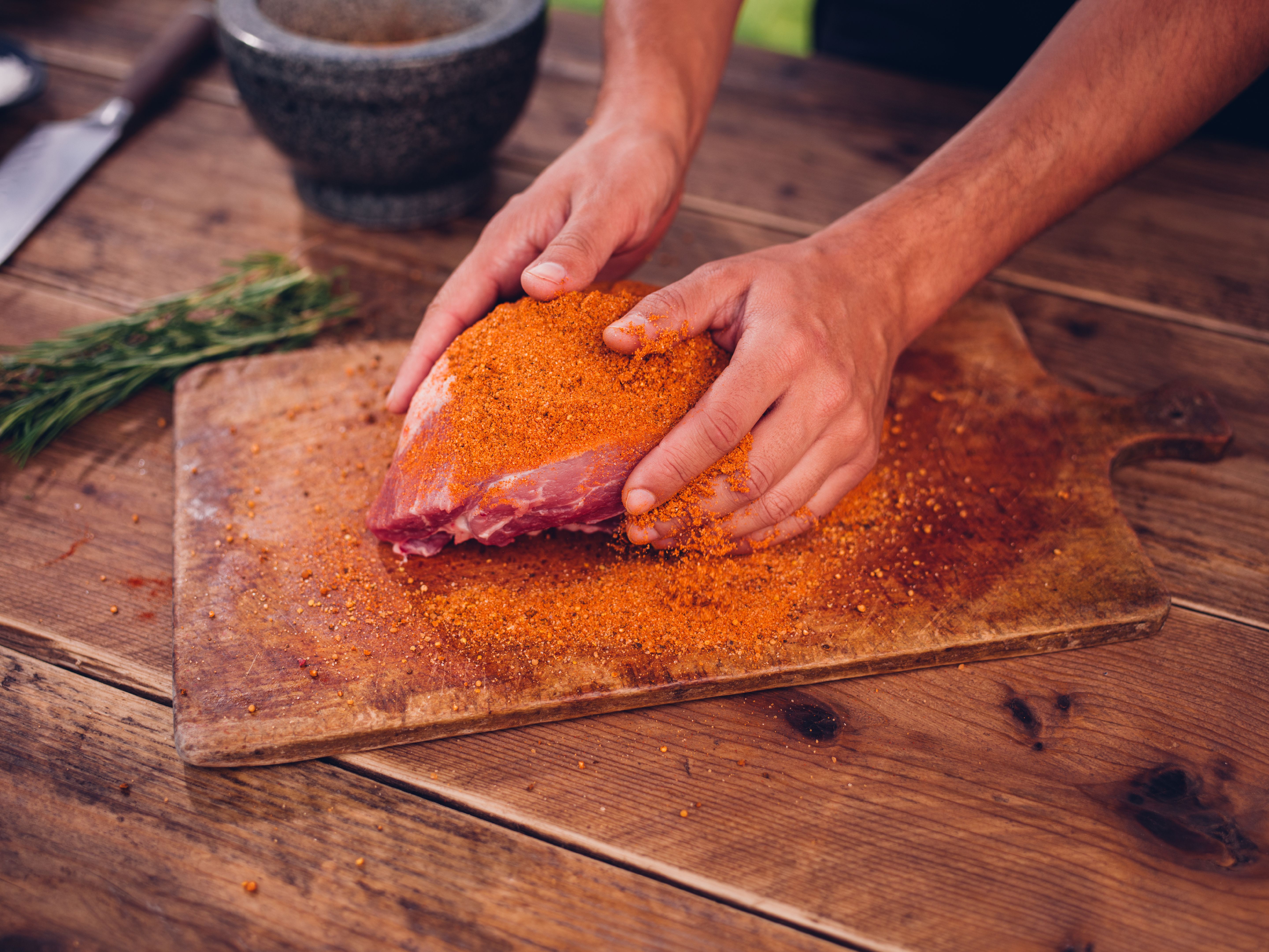 applying rub on meat