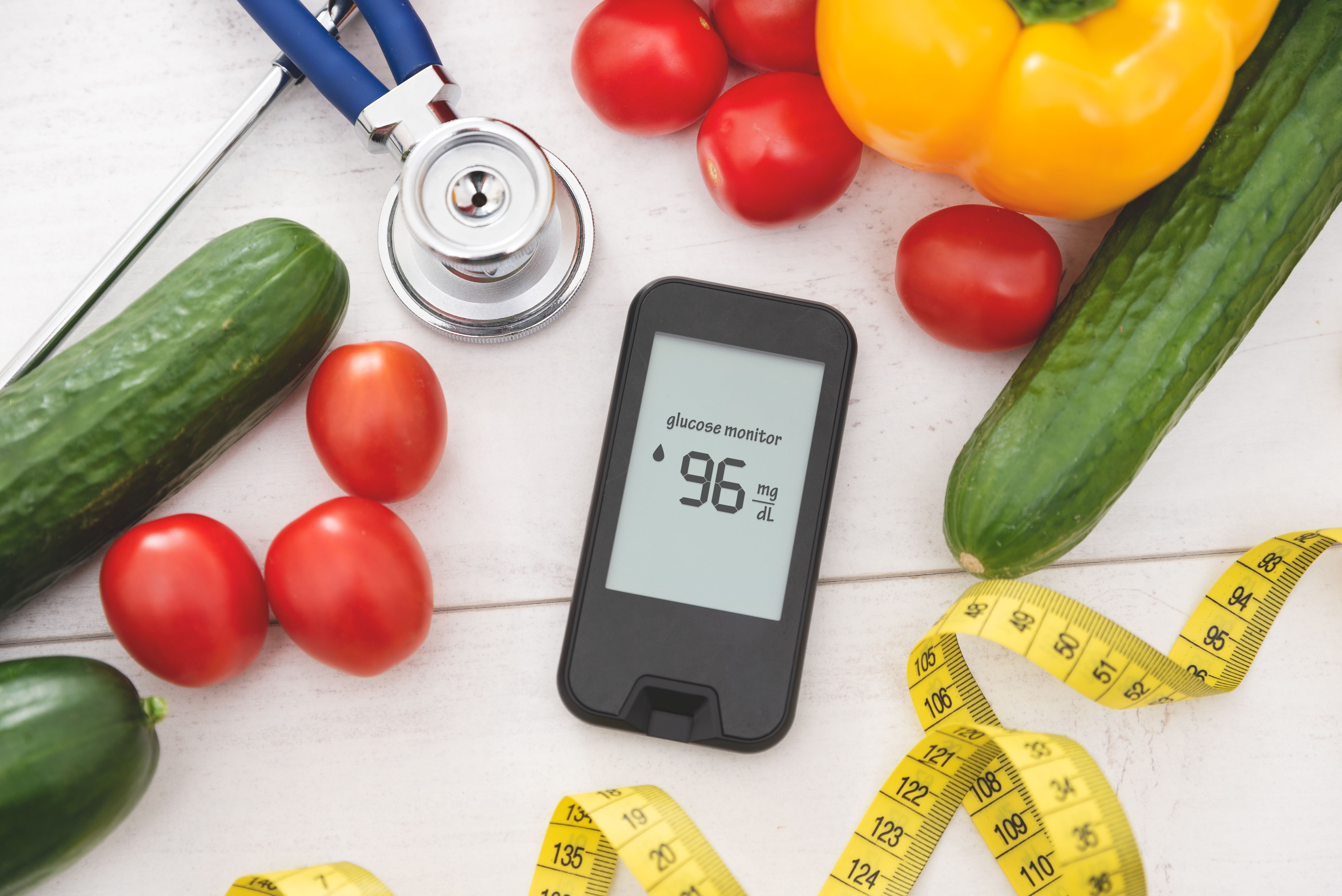 Glucometer with fresh vegetables. Diabetes concept