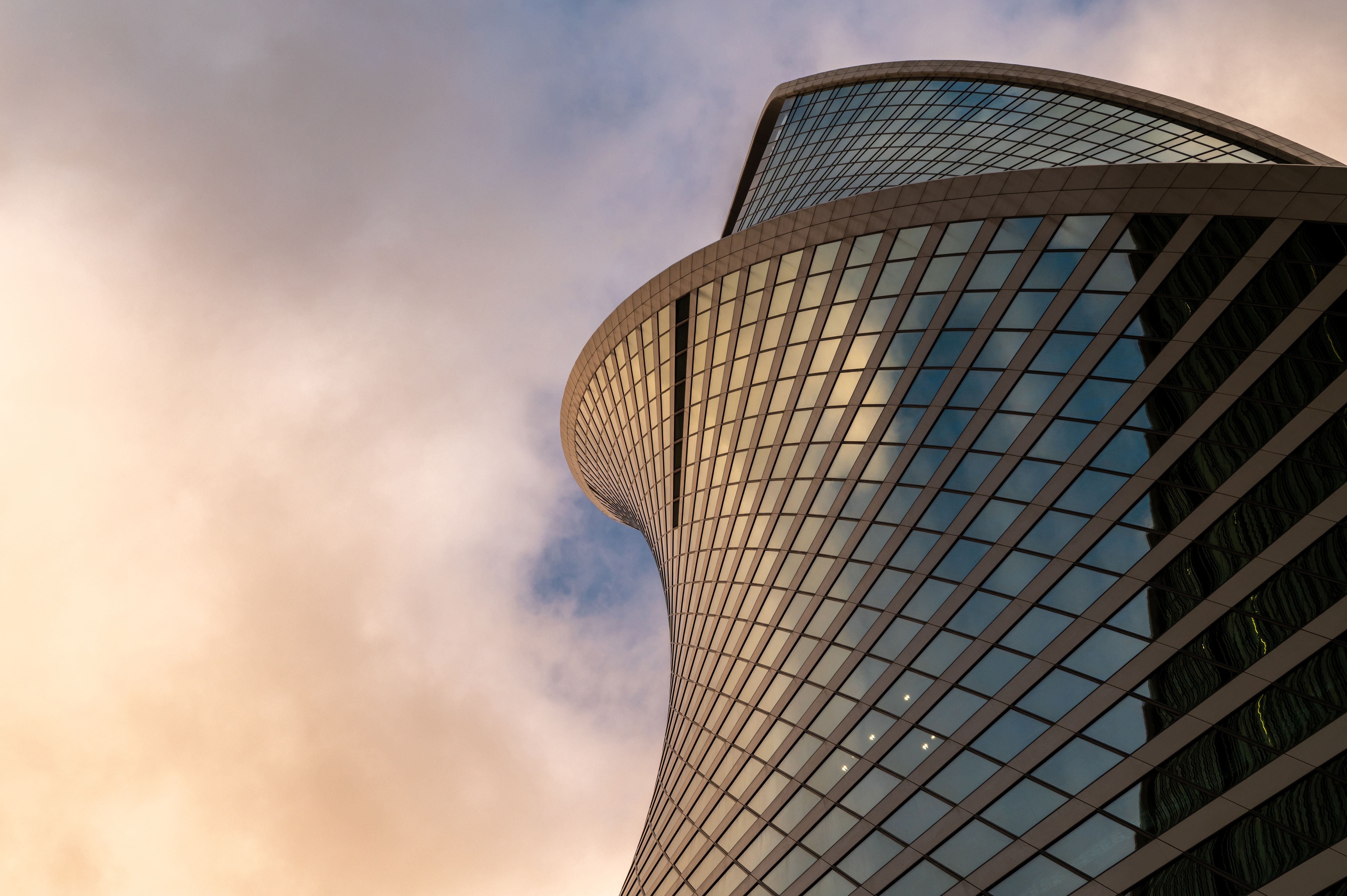 Skyscrapers in business district against blue sky.