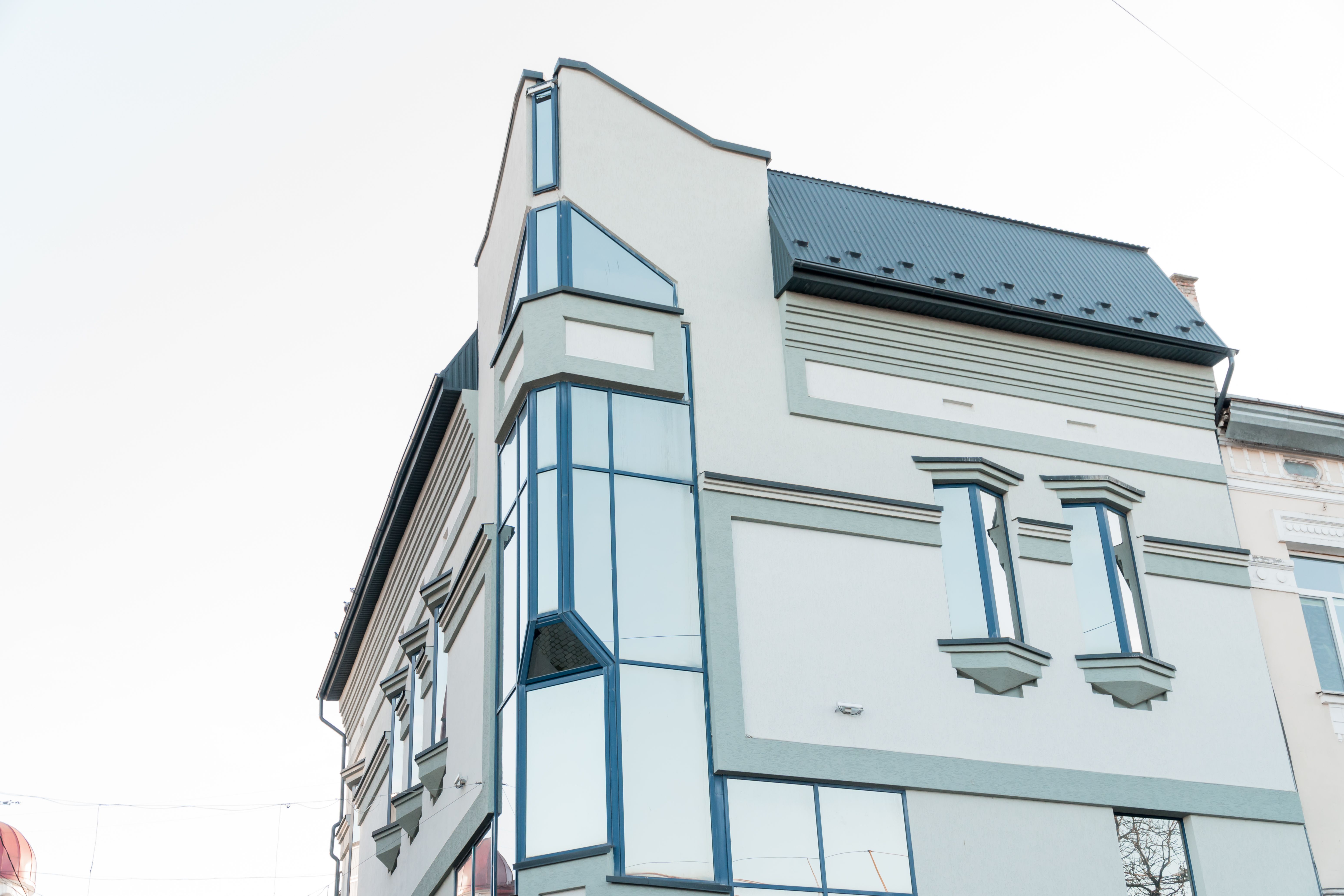 Modern Architectural Marvel Featuring Striking Angled Facade and Glass Elements Modern Architectural Marvel Featuring Striking Angled Facade and Glass Elements