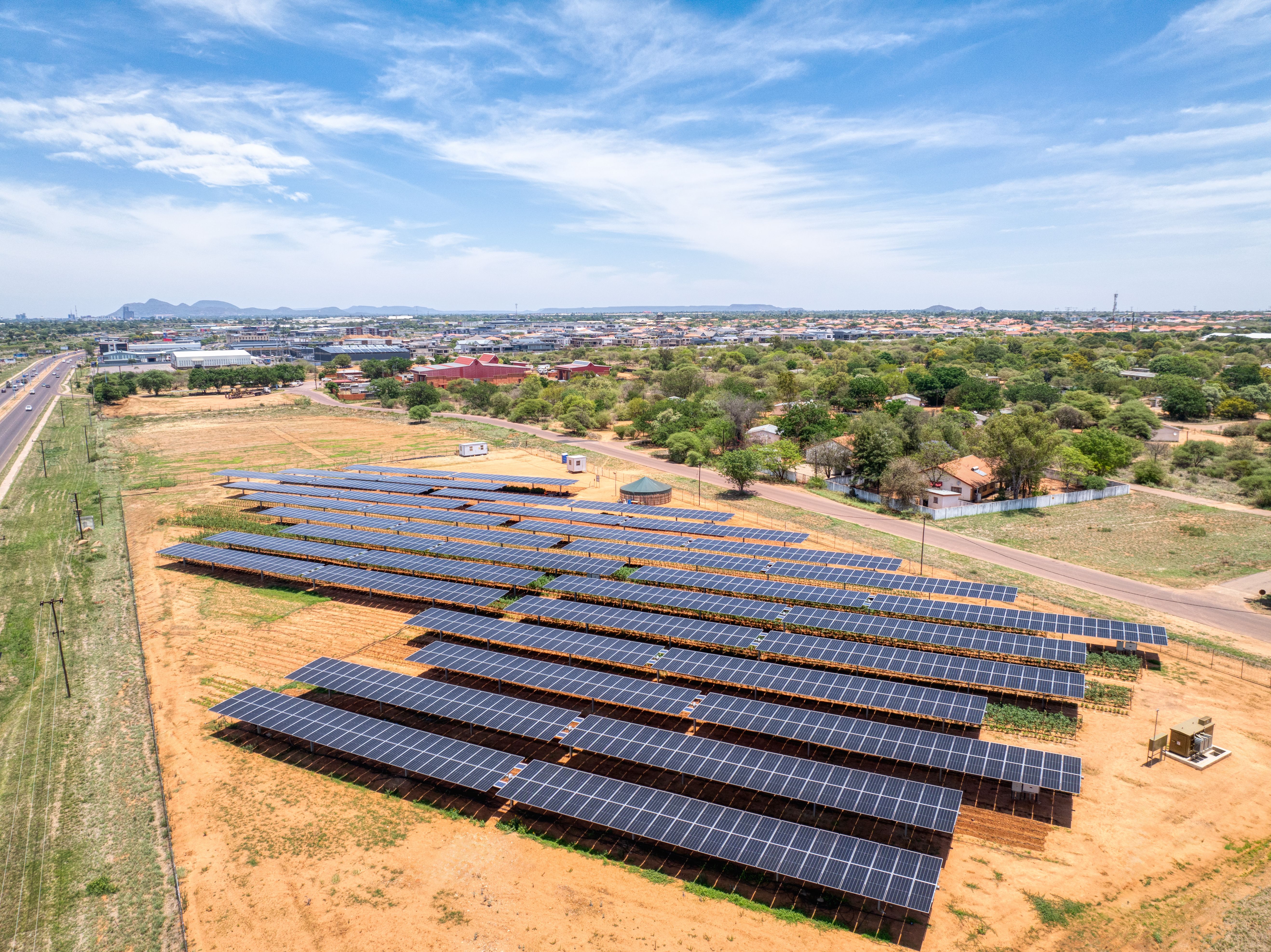 Aerial view, of Gaborone capital city of Botswana, solar panels above crops ensuring fresh vegetables for the city