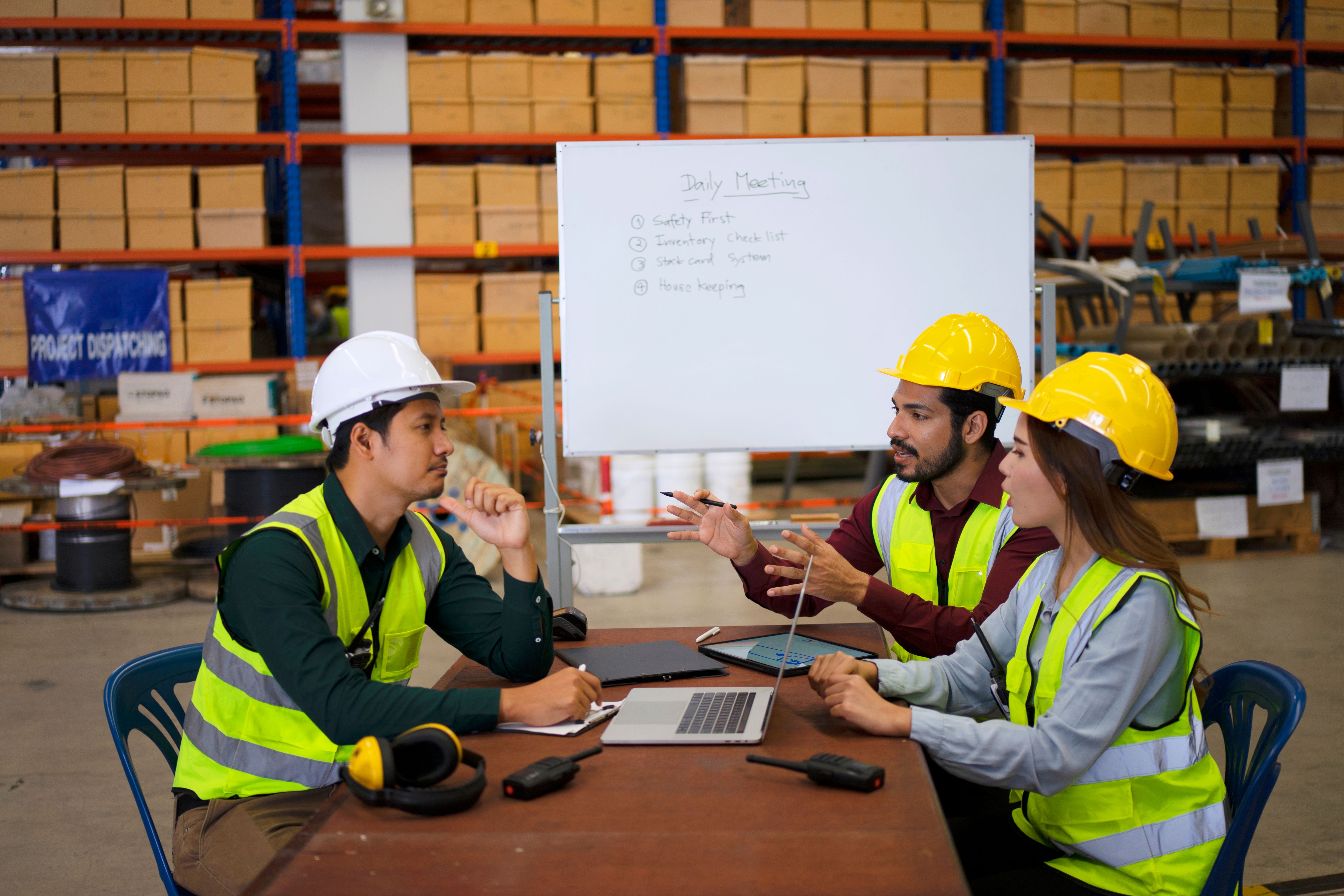 Warehouse workers receiving practical forklift training