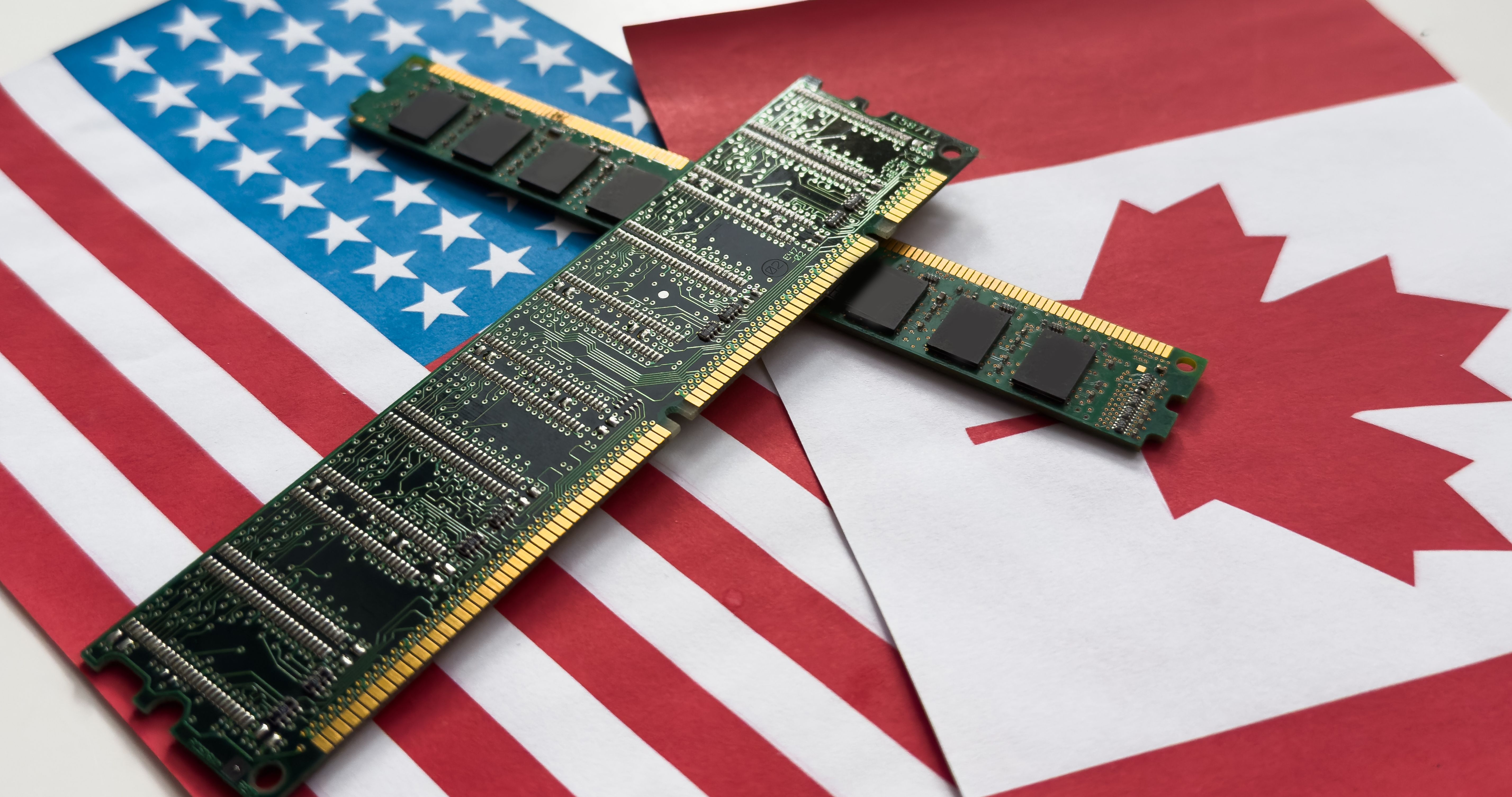 Graphics card with processor and microchip with flags of the USA and Canada. Concept for global battle and monopoly on microchip manufacturing USA