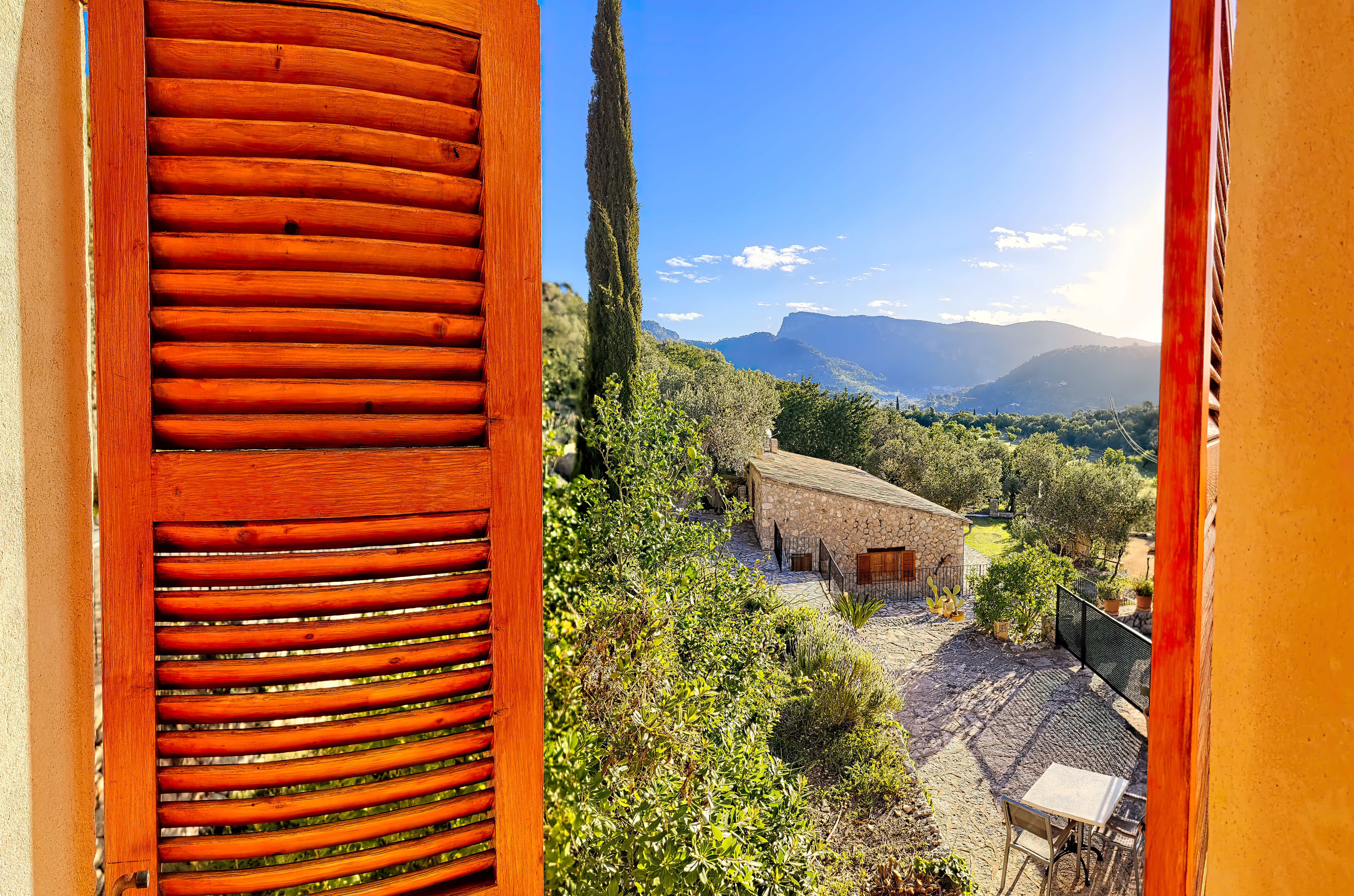 View from the window through the shutters in the morning in Majorca