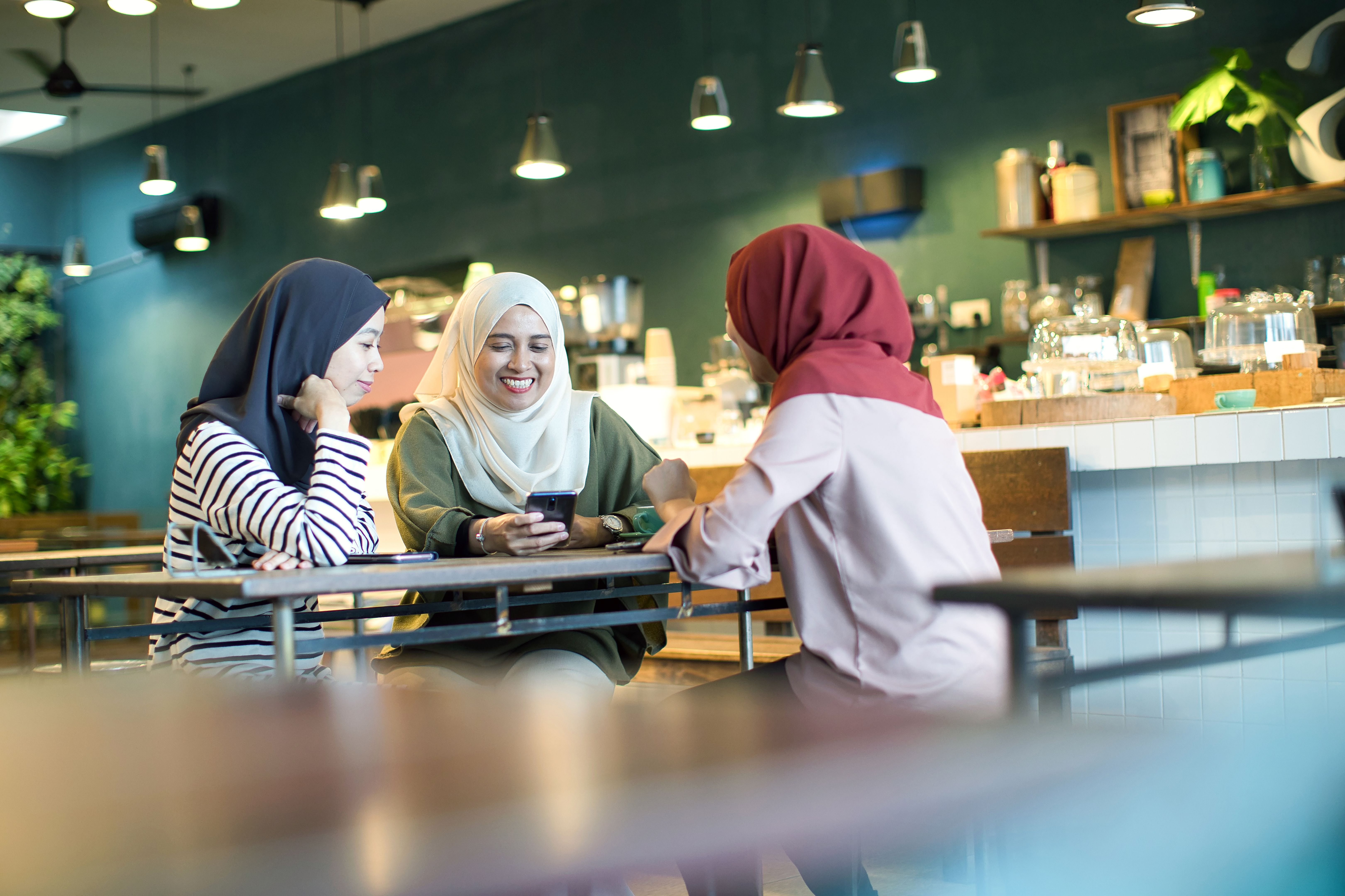 Group of young women meeting at a cafe Group of young women meeting at a cafe