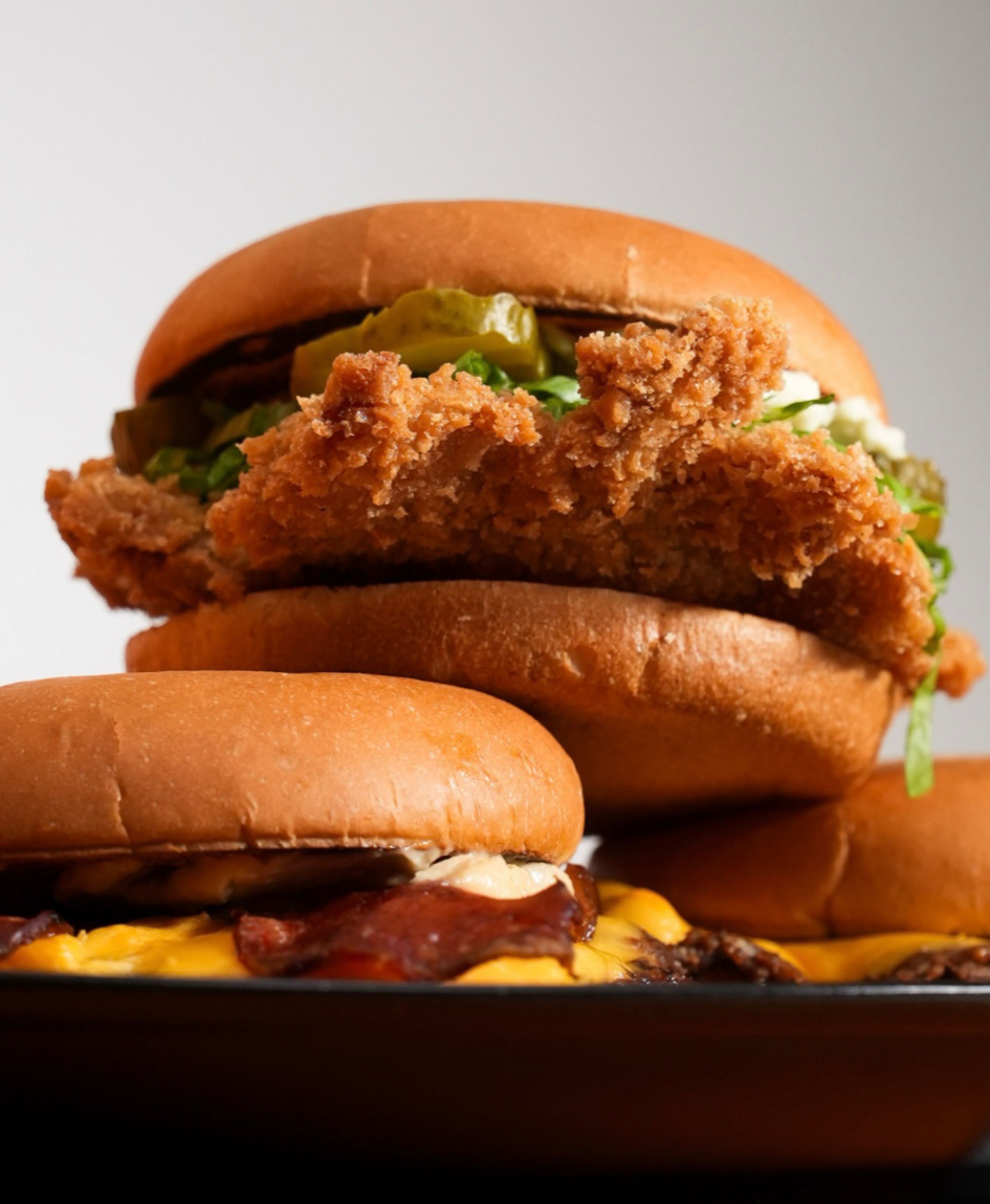 Delicious Brazilian burger with cheddar, bacon, mussarella, ham, tomato and special sauce ready to eat