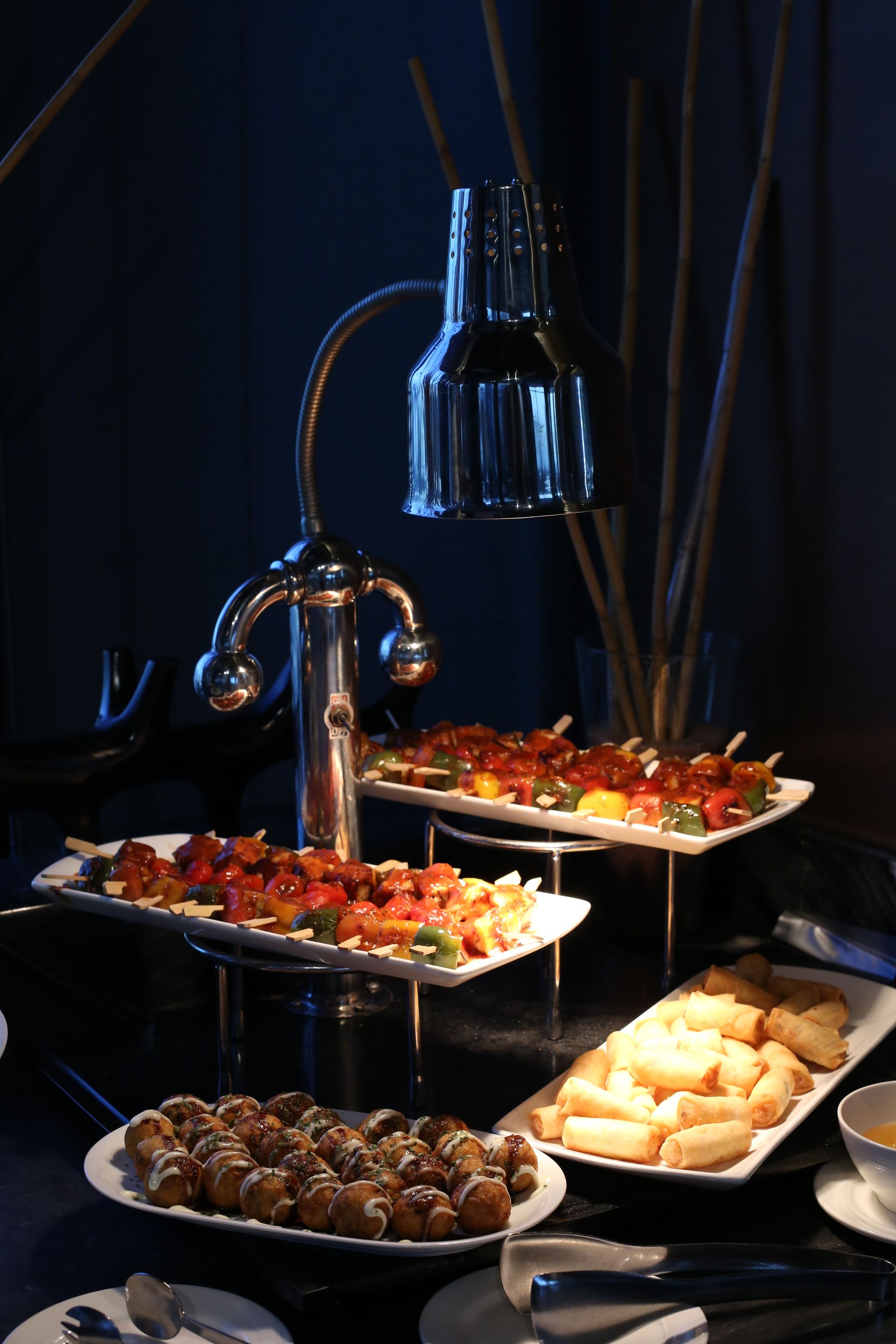 Elegant Buffet Setup with Skewers and Appetizers Elegant Buffet Setup with Skewers and Appetizers