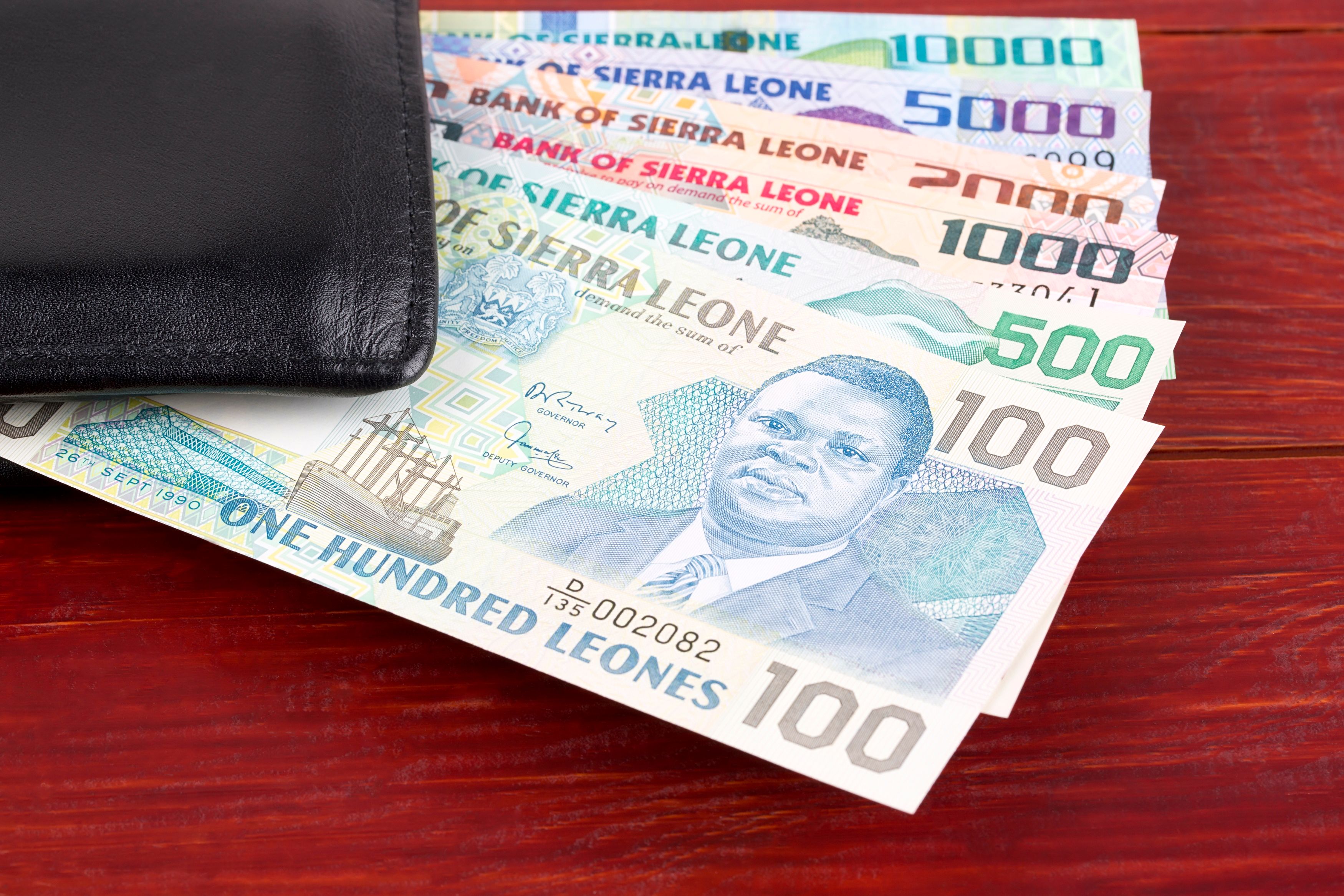 Sierra Leonean money in the black wallet Sierra Leonean money in the black wallet