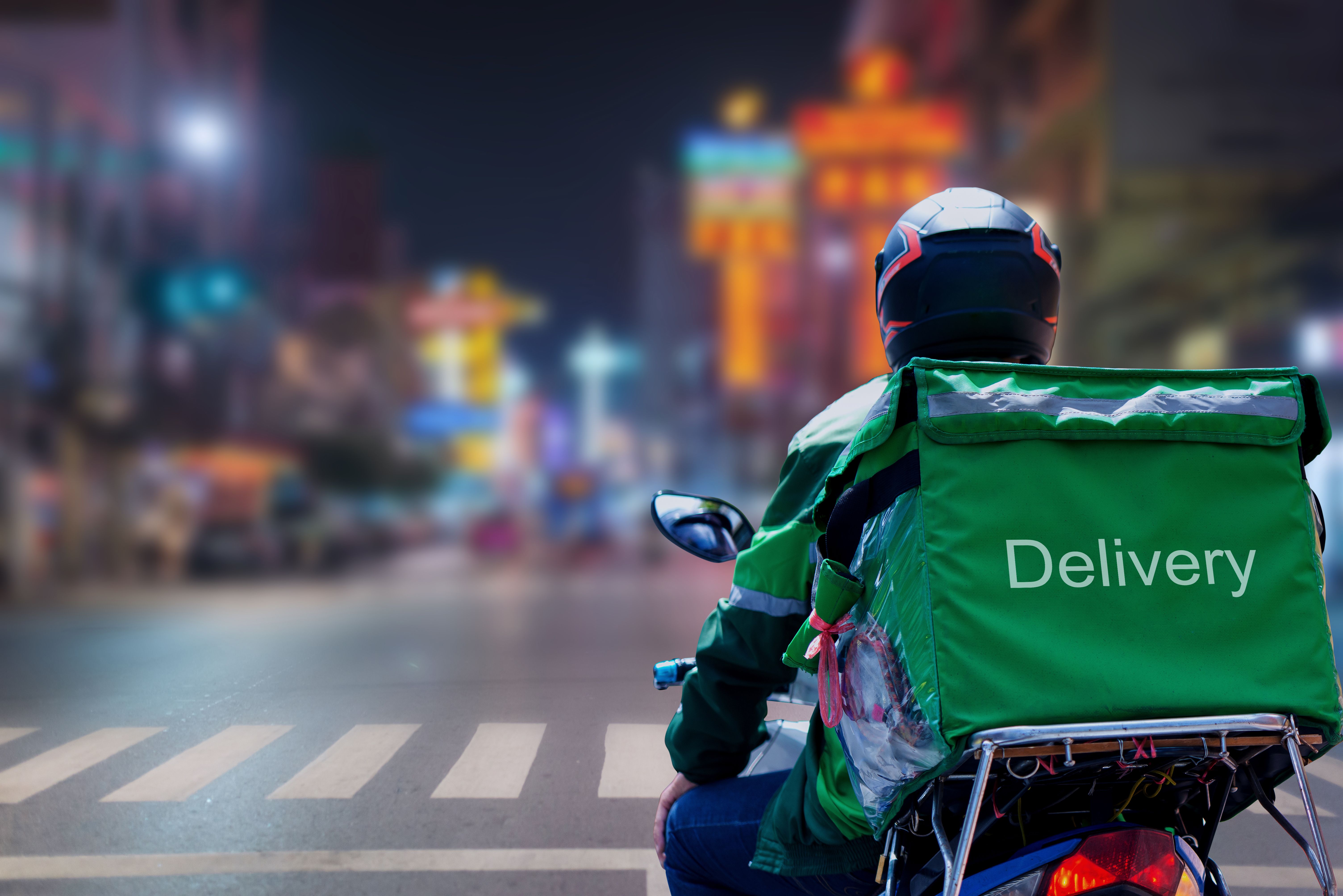 At Street Food in night city, Thailand, delivery drivers are making deliveries to consumers who have placed online orders At Street Food in night city, Thailand, delivery drivers are making deliveries to consumers who have placed online orders