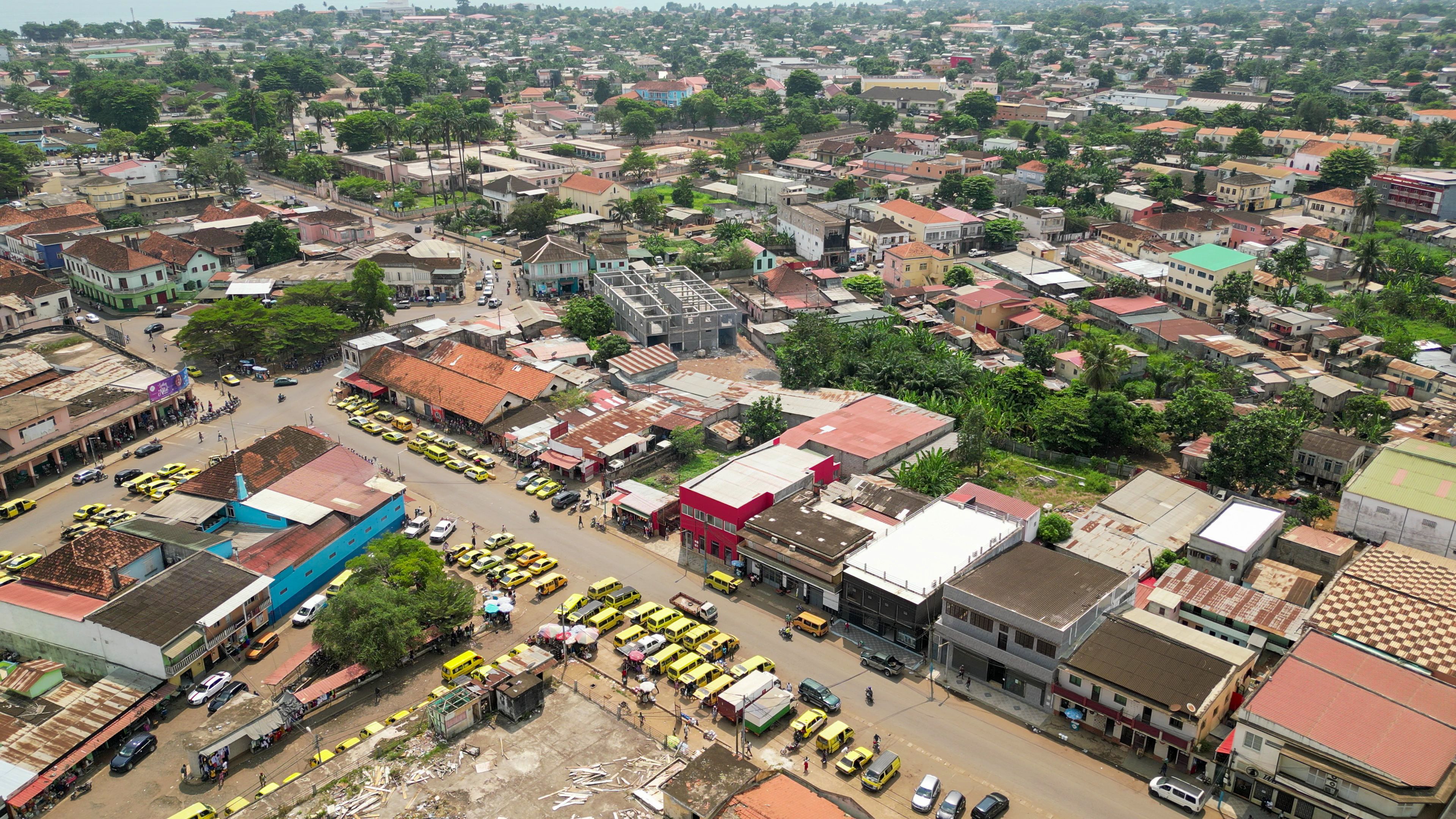 Seen from above a cluster of stopped taxis in the city of Sao Tome Seen from above a cluster of stopped taxis in the city of Sao Tome