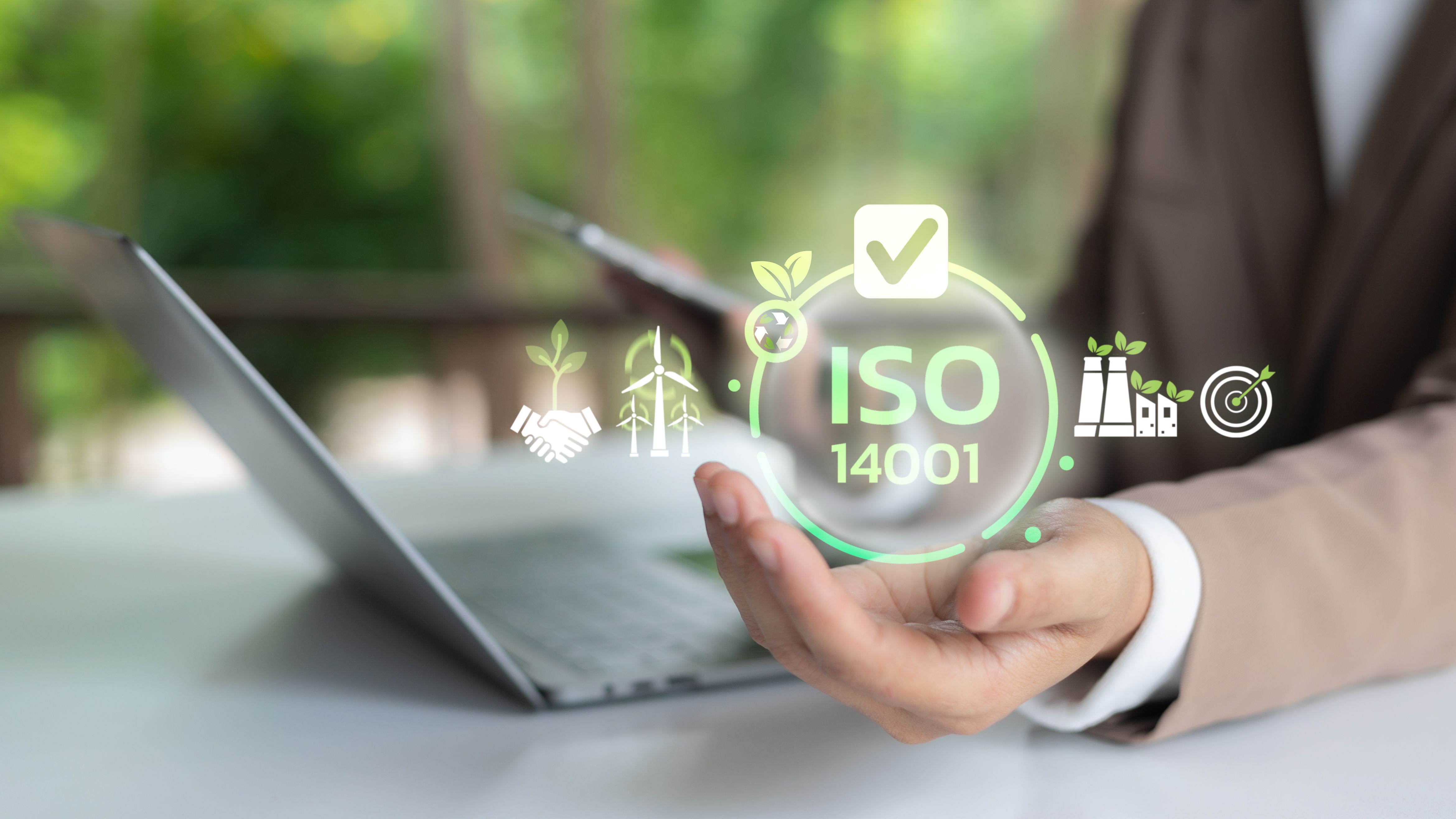 Businesswoman holding ISO 14001 certification icon with laptop, symbol of environmental management system, sustainable business, eco industry and corporate responsibility.