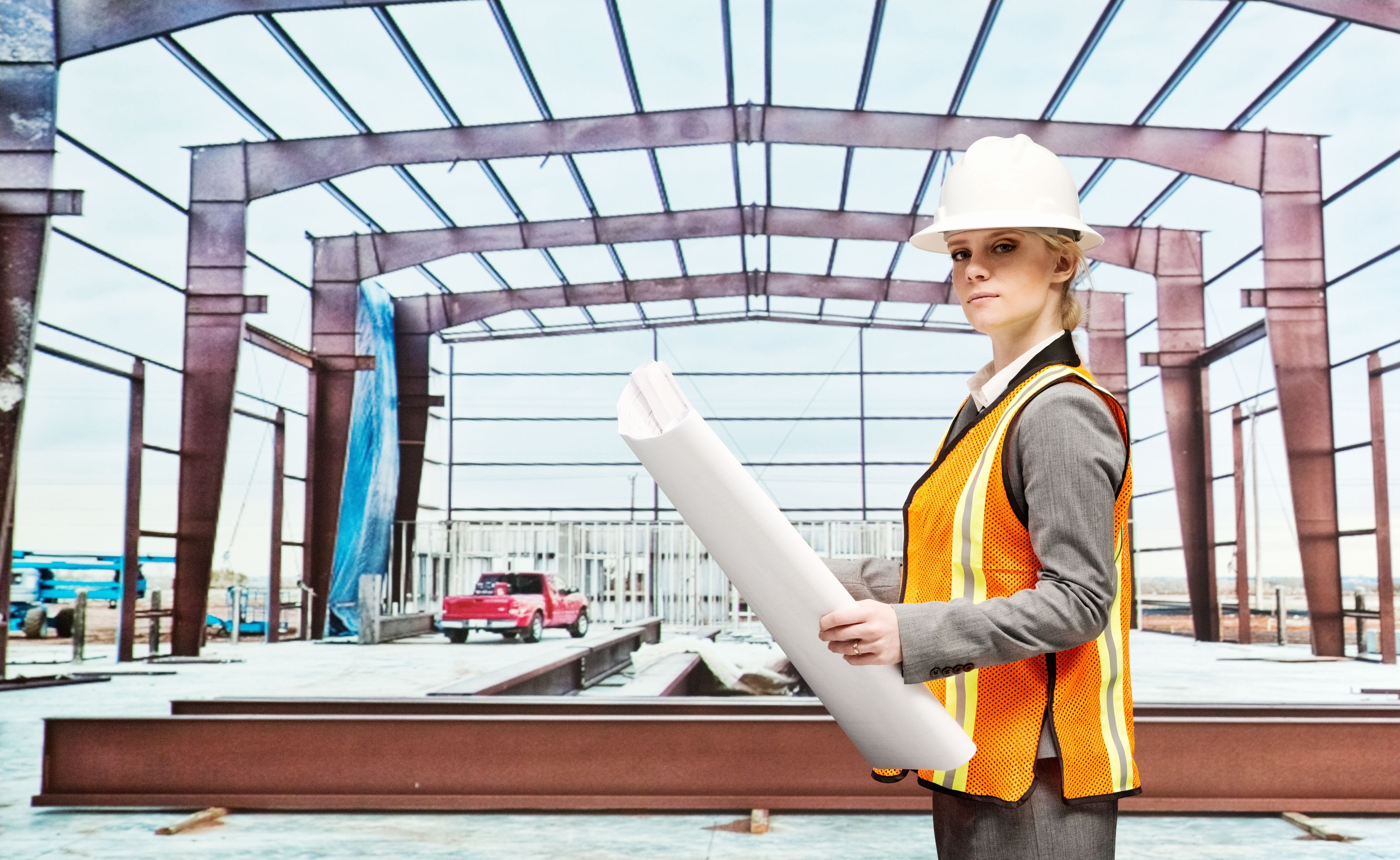Architect posing with blueprints Architect posing with blueprints