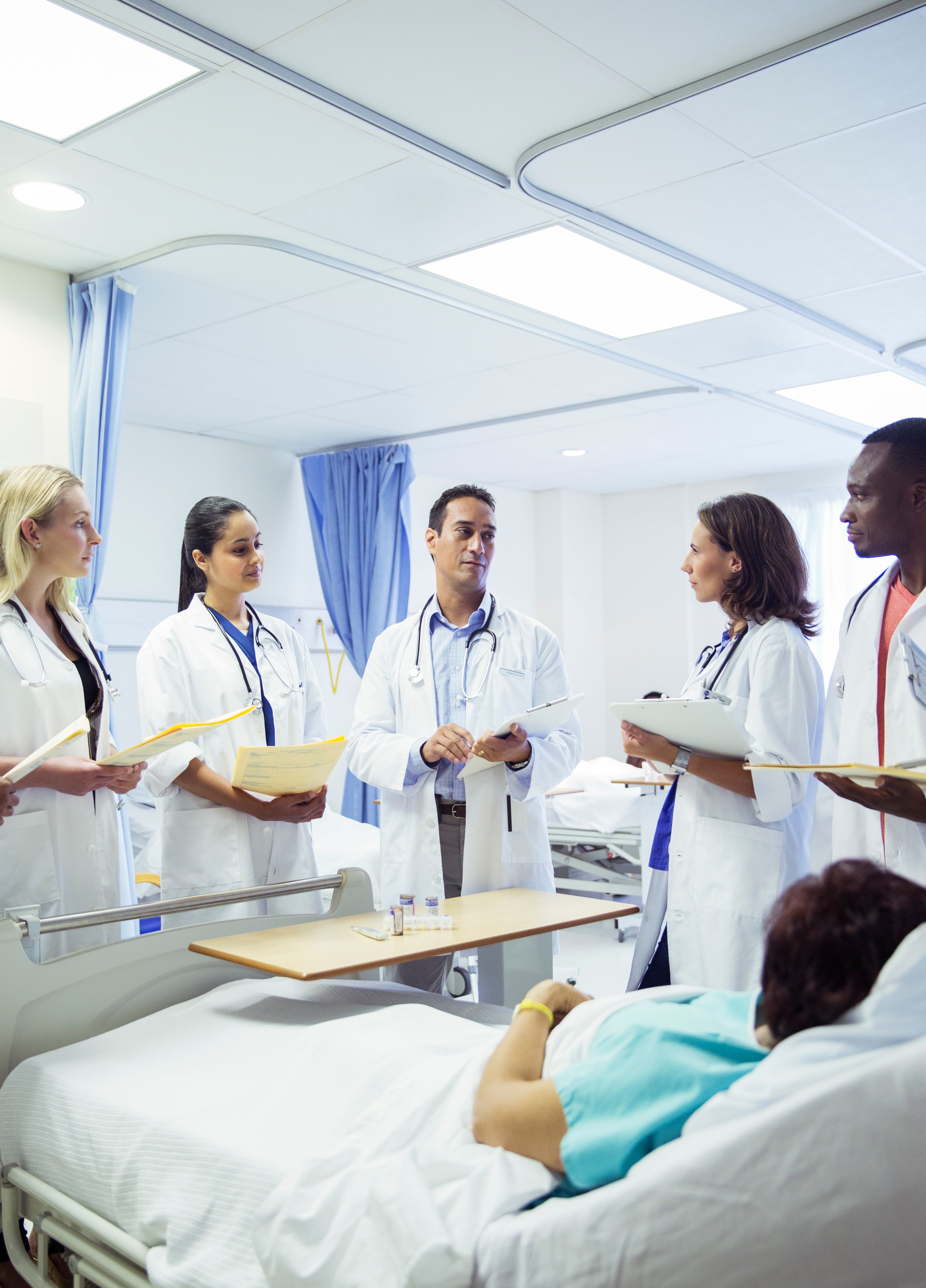 Doctor teaching residents in hospital room
