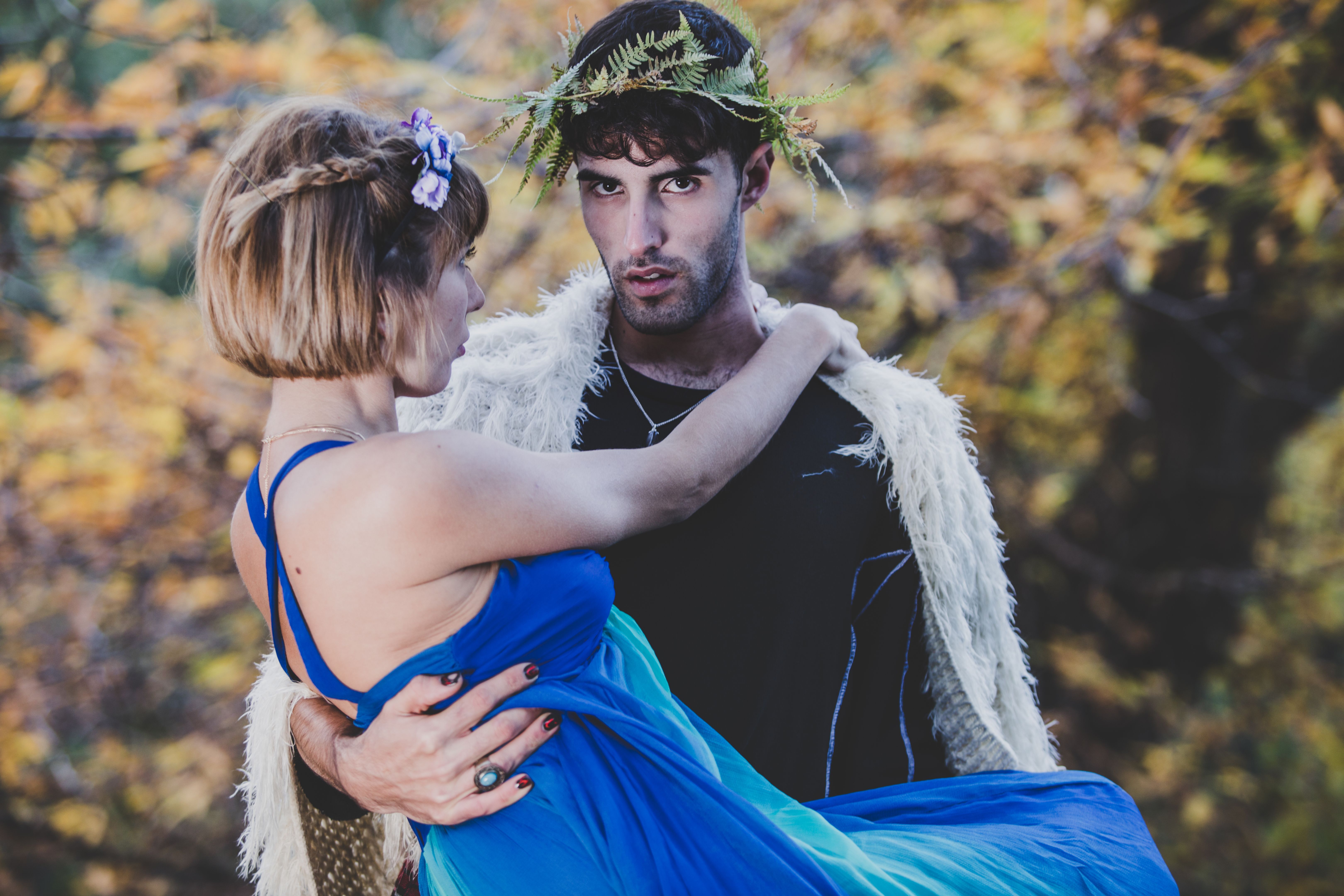 A Fairy Tale Couple in Romantic Costumes Heading into The Woods A Fairy Tale Couple in Romantic Costumes Heading into The Woods