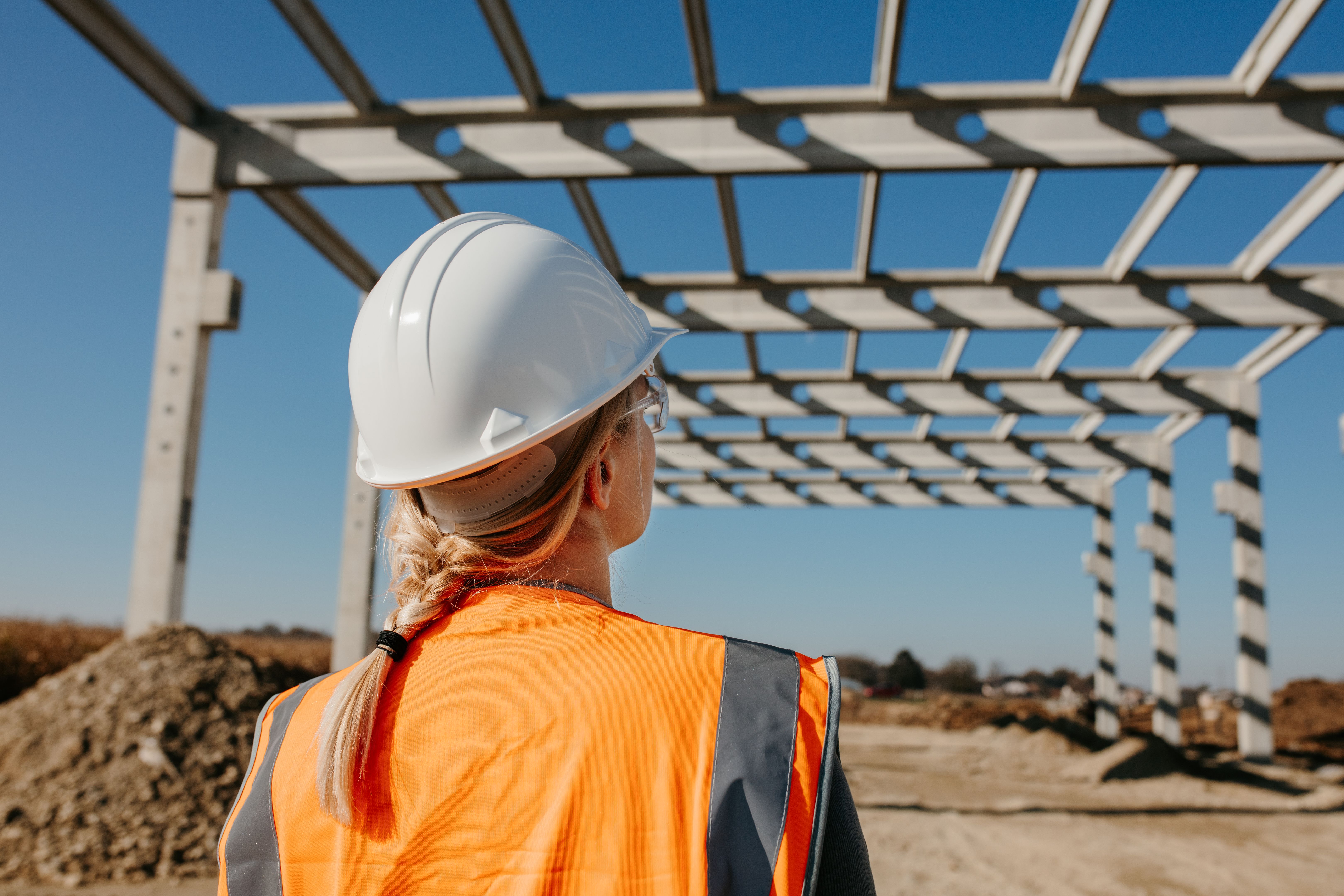 Engineer evaluating work at construction site Engineer evaluating work at construction site
