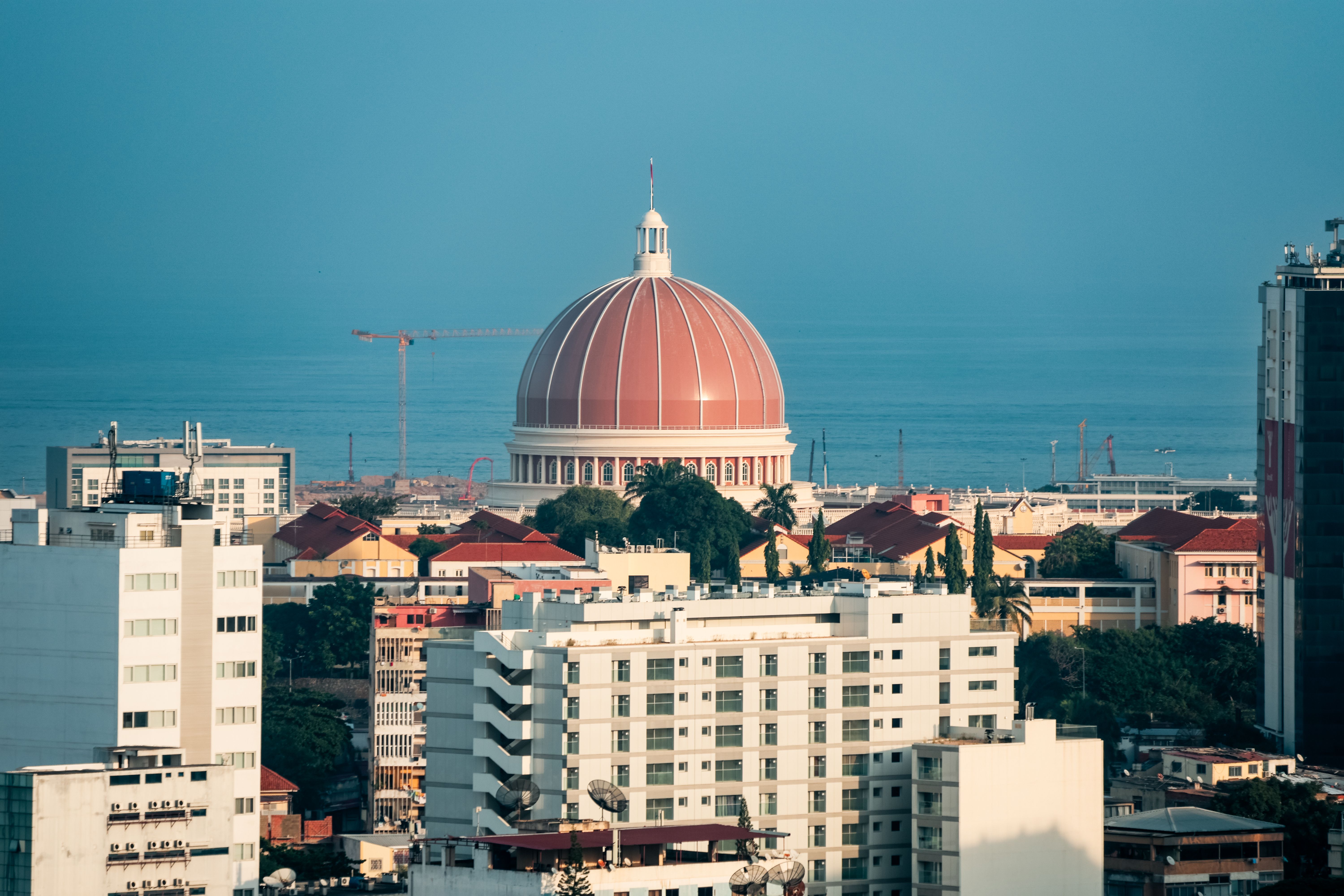 A panoramic view of Luanda Angola showcasing the iconic dome and bustling urban life under a clear blue sky A panoramic view of Luanda Angola showcasing the iconic dome and bustling urban life under a clear blue sky
