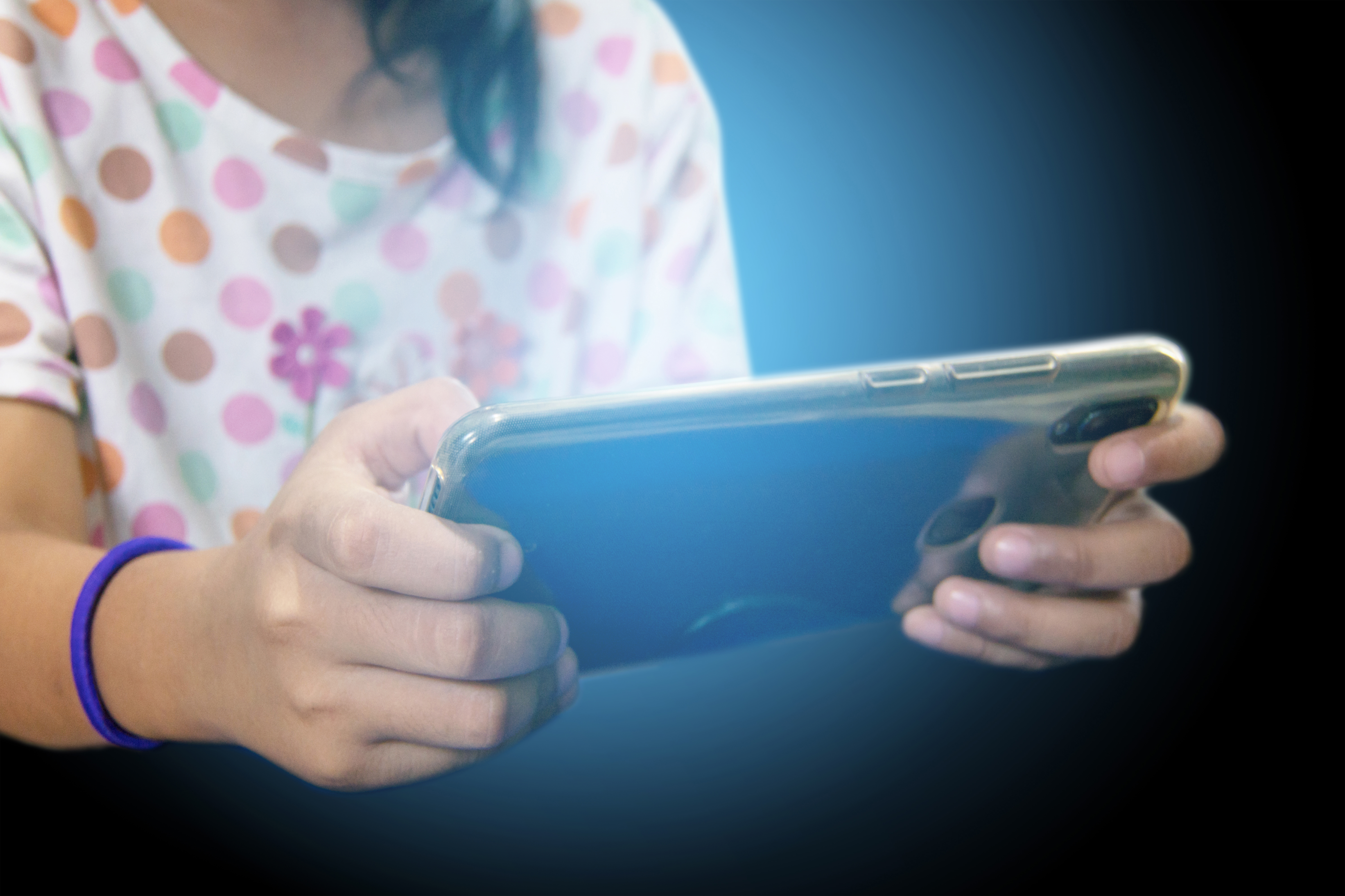 teen girl play smart phone, Blue light from mobile. teen girl play smart phone, Blue light from mobile.