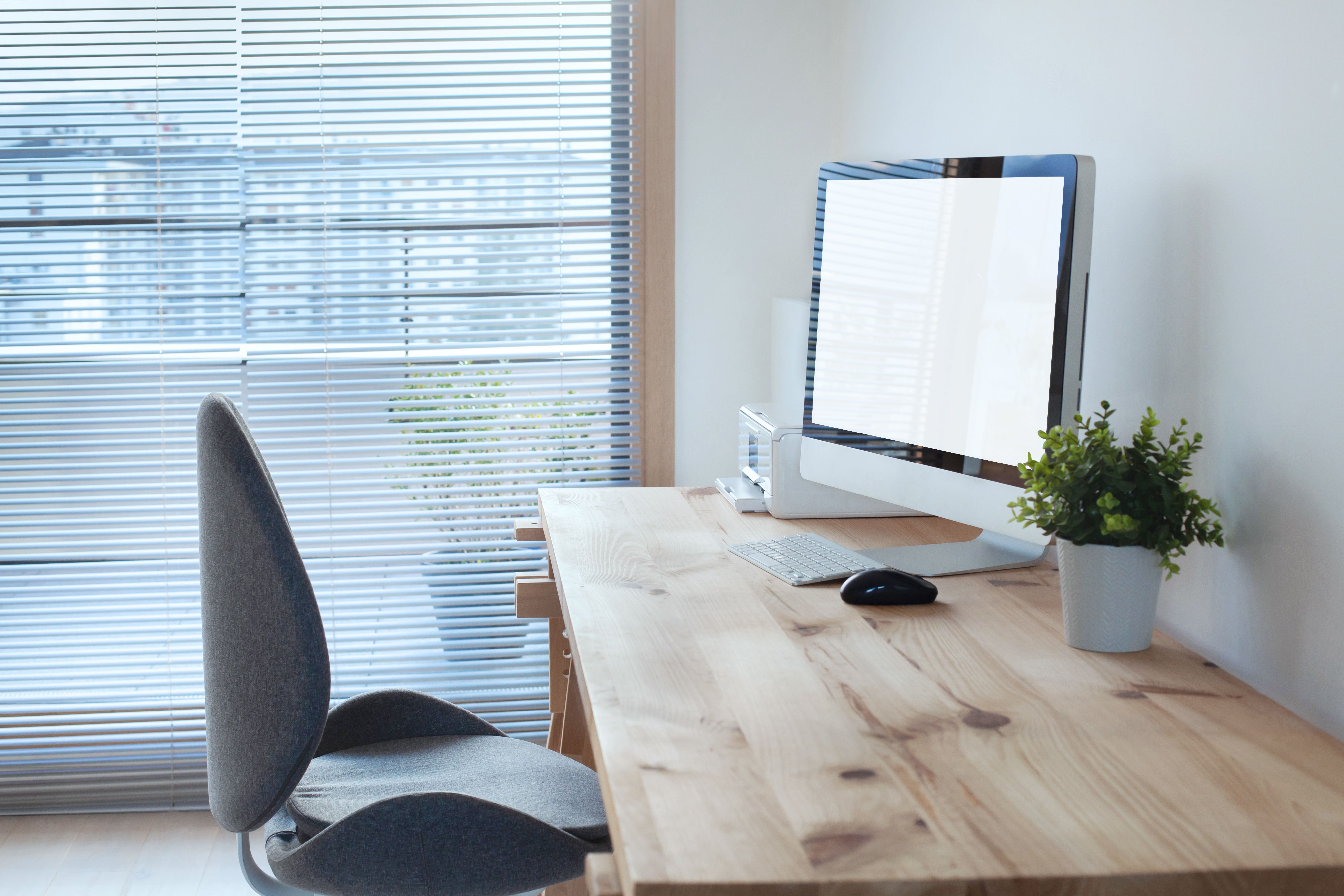 workspace interior with computer on wooden table and office chair workspace interior with computer on wooden table and office chair