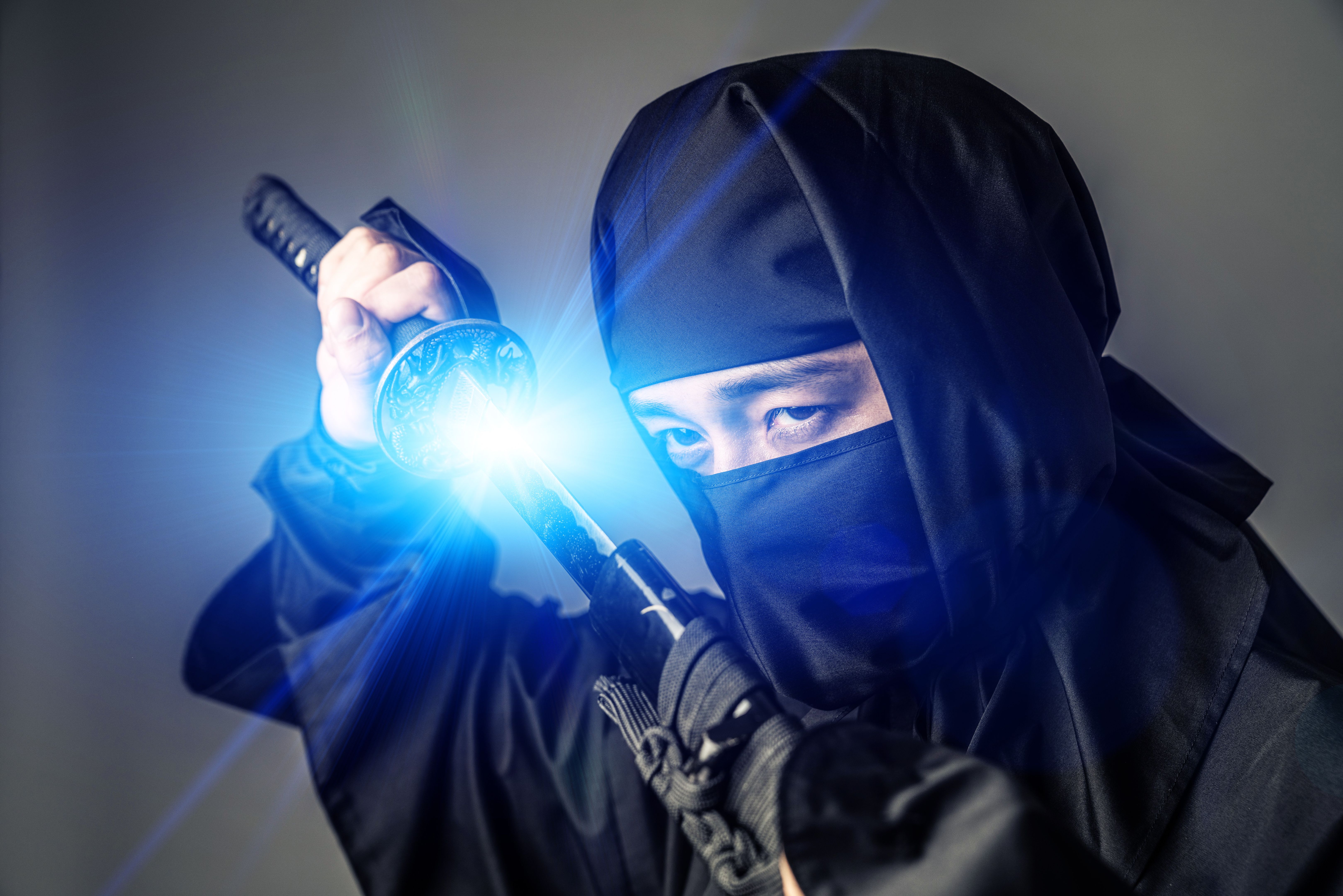 Japanese Ninja holding a katana. Samurai.